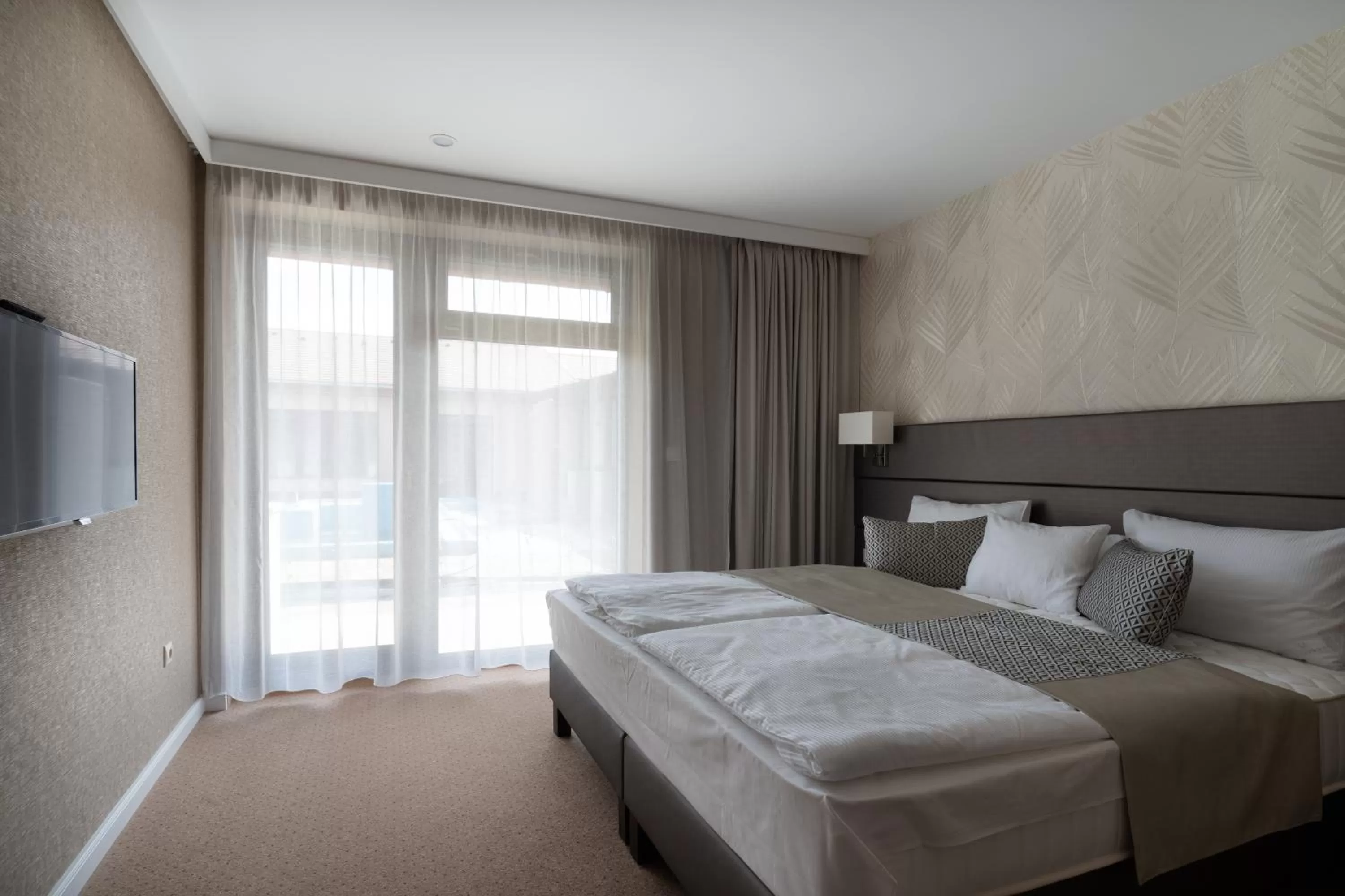 Bed in DorEsz Wellness Panzió