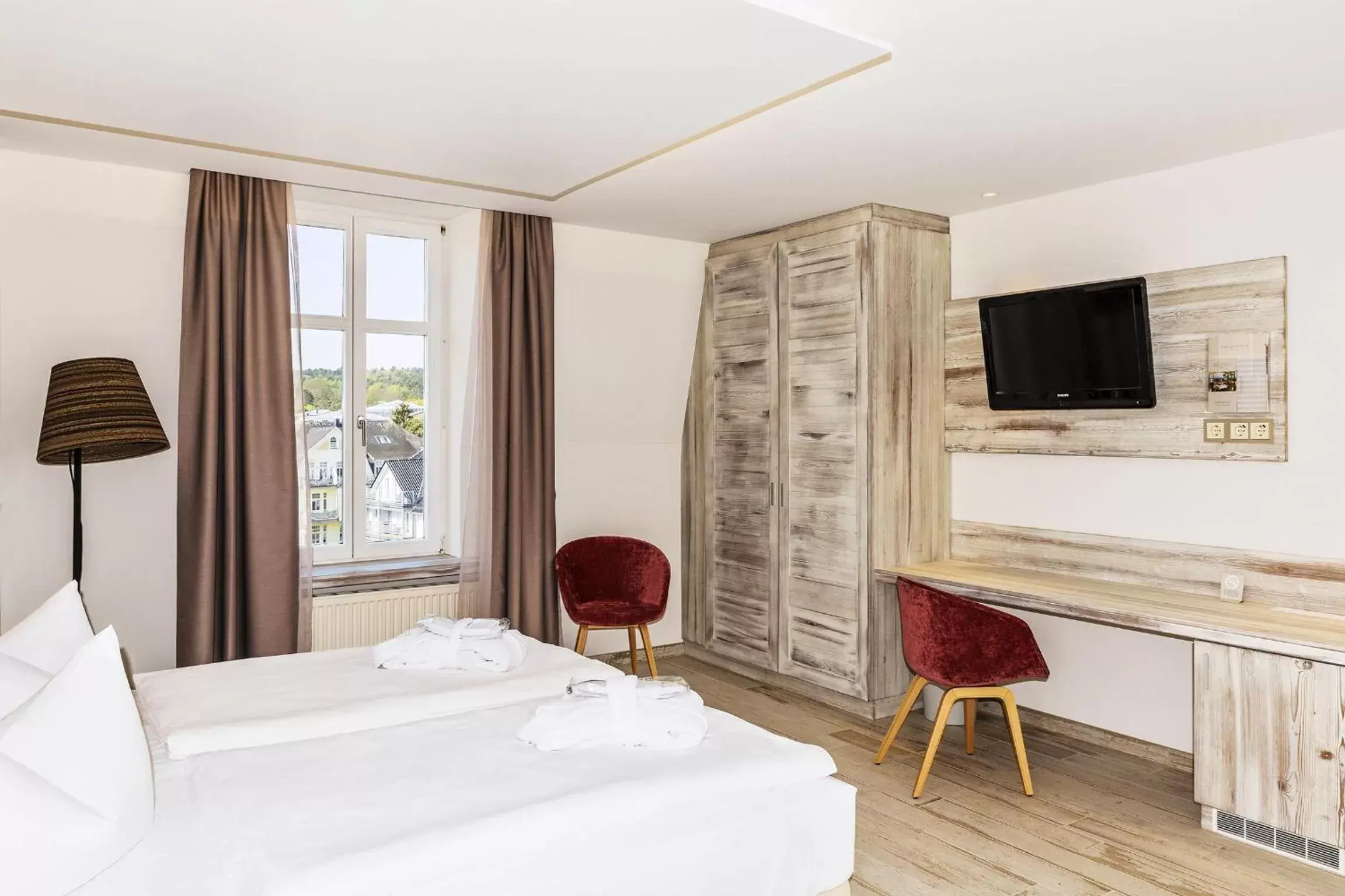Photo of the whole room, Bed in SEETELHOTEL Strandhotel Atlantic