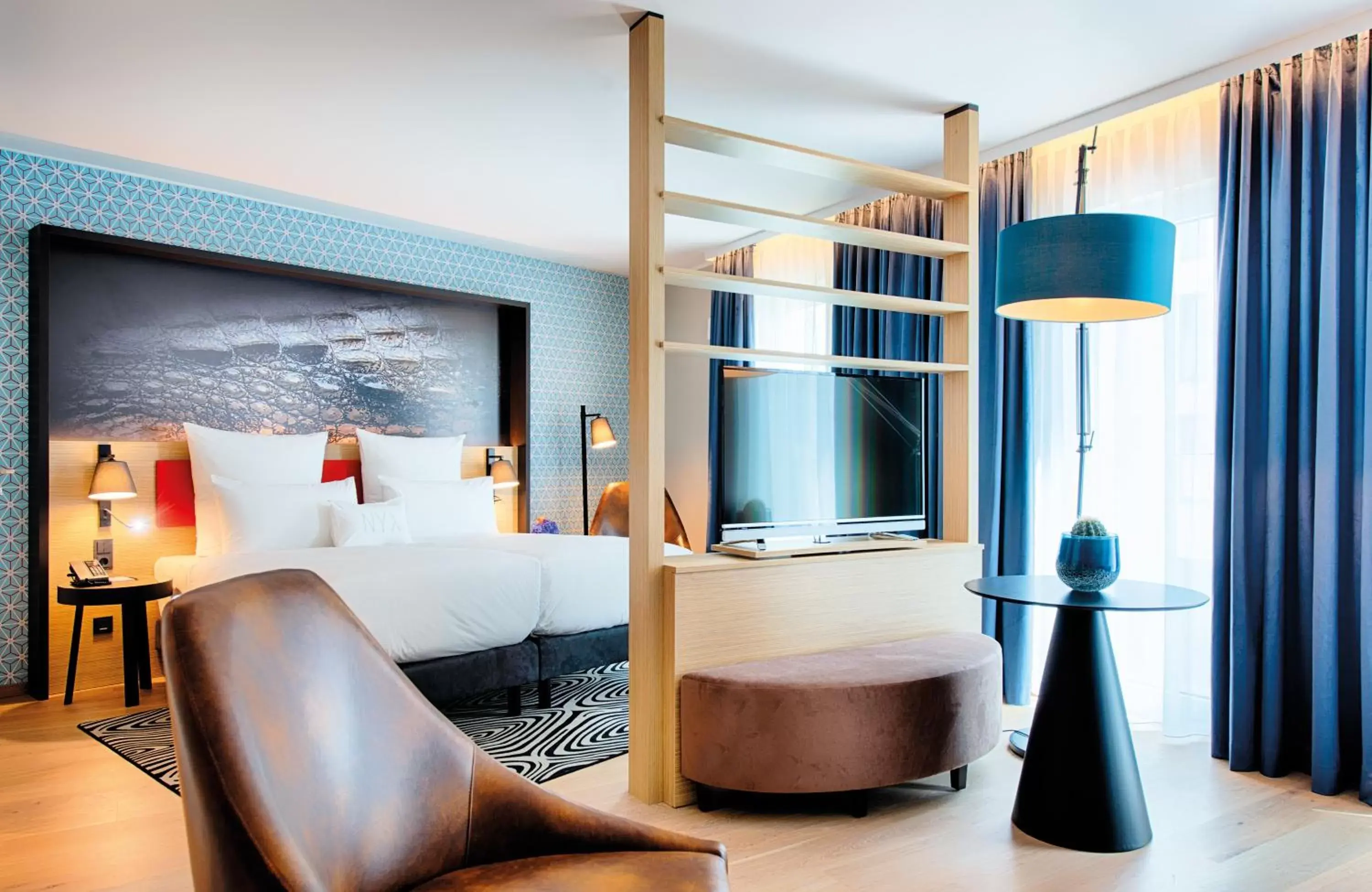 Photo of the whole room, Bed in NYX Hotel Munich by Leonardo Hotels