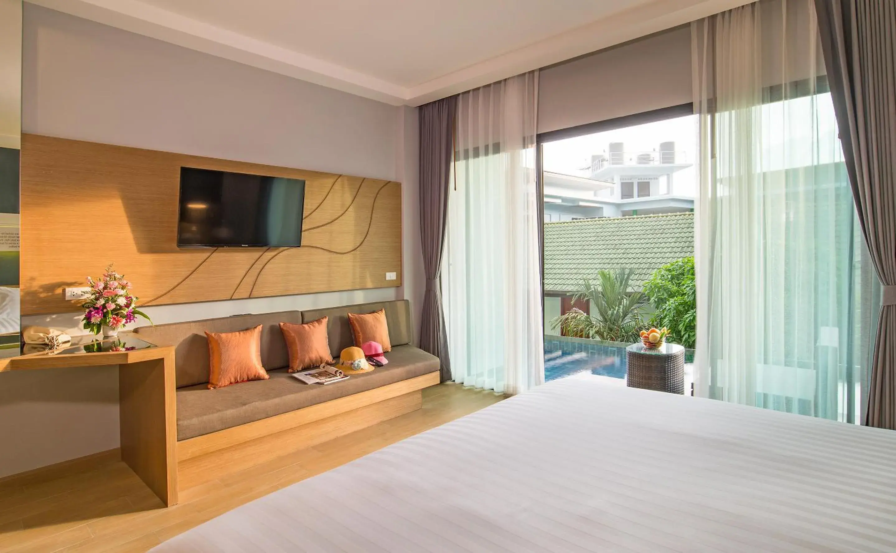 Bed, TV/Entertainment Center in AVA SEA Resort Ao Nang Beach-SHA Extra Plus