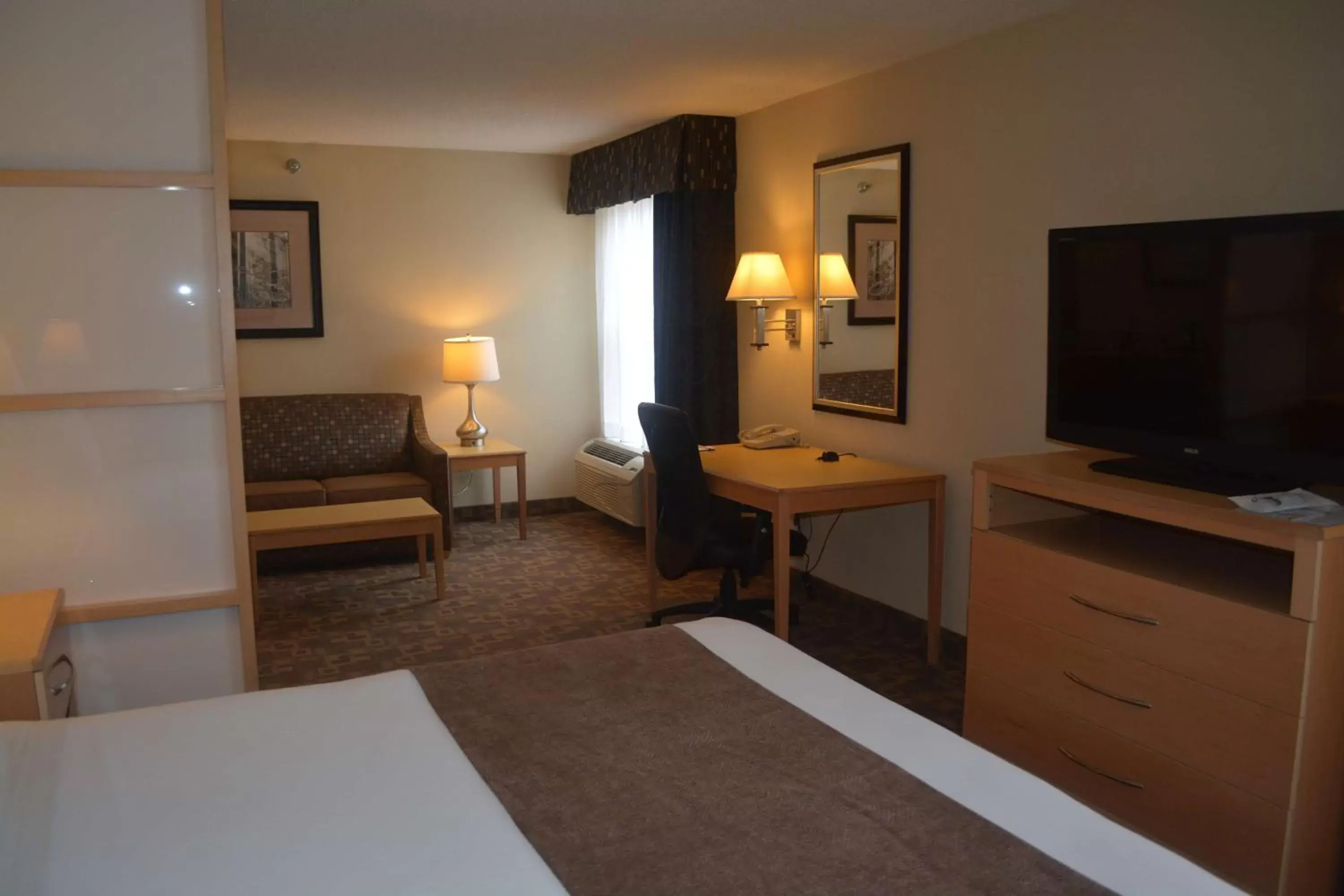 Photo of the whole room, TV/Entertainment Center in SureStay Plus Hotel by Best Western Roanoke Rapids I-95