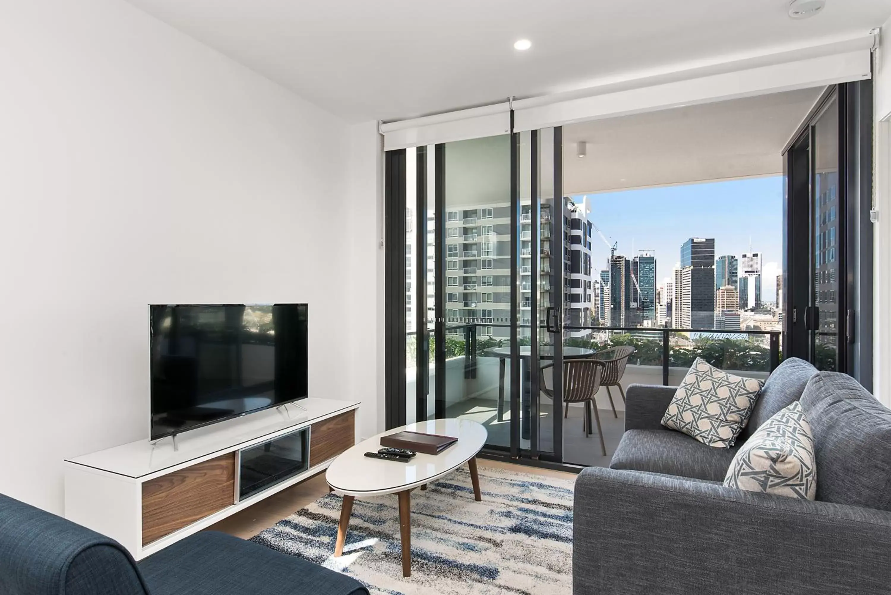 TV and multimedia, Seating Area in Ivy and Eve Apartments by CLLIX