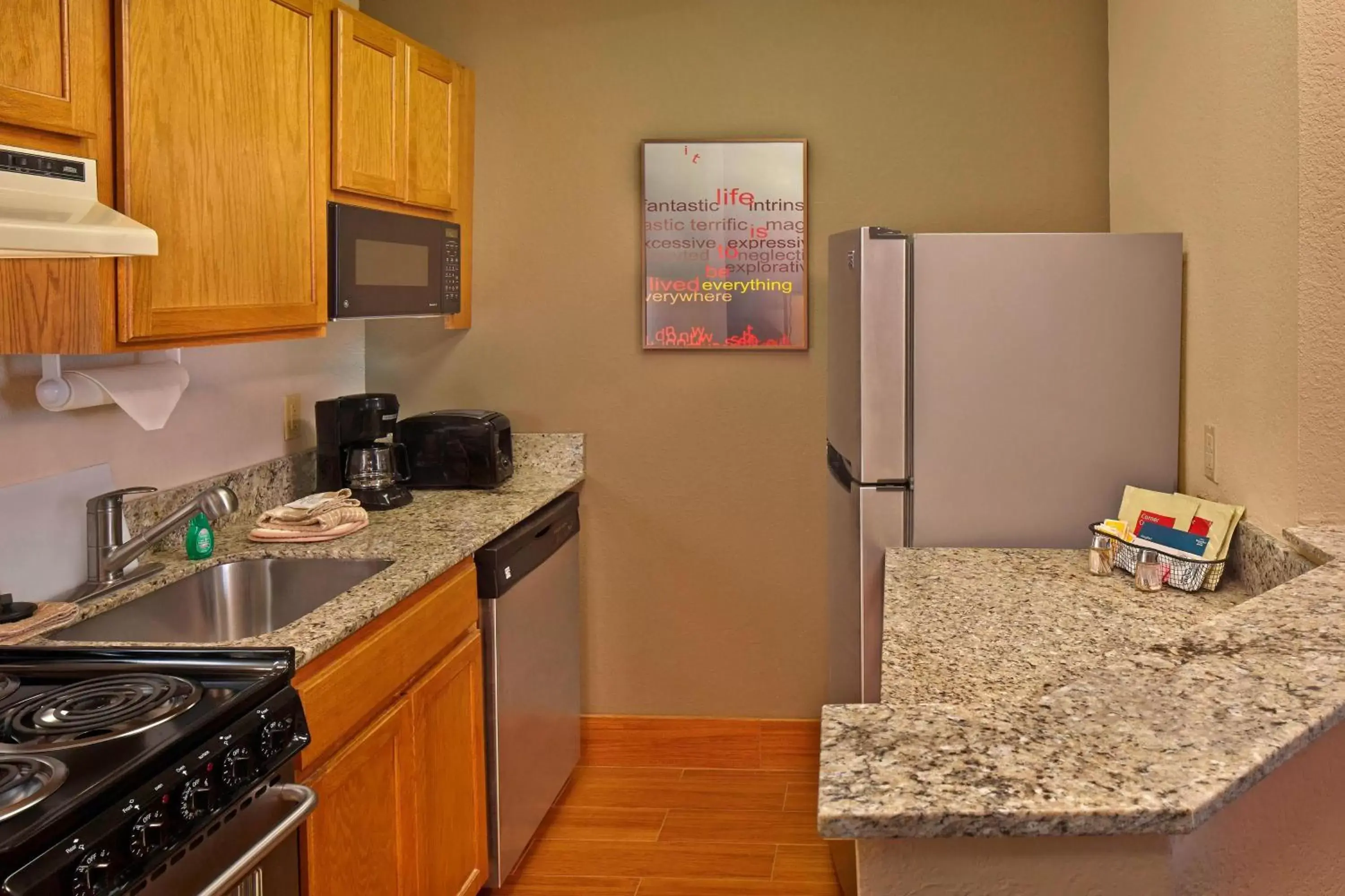 Bedroom, Kitchen/Kitchenette in TownePlace Suites by Marriott Fort Lauderdale Weston