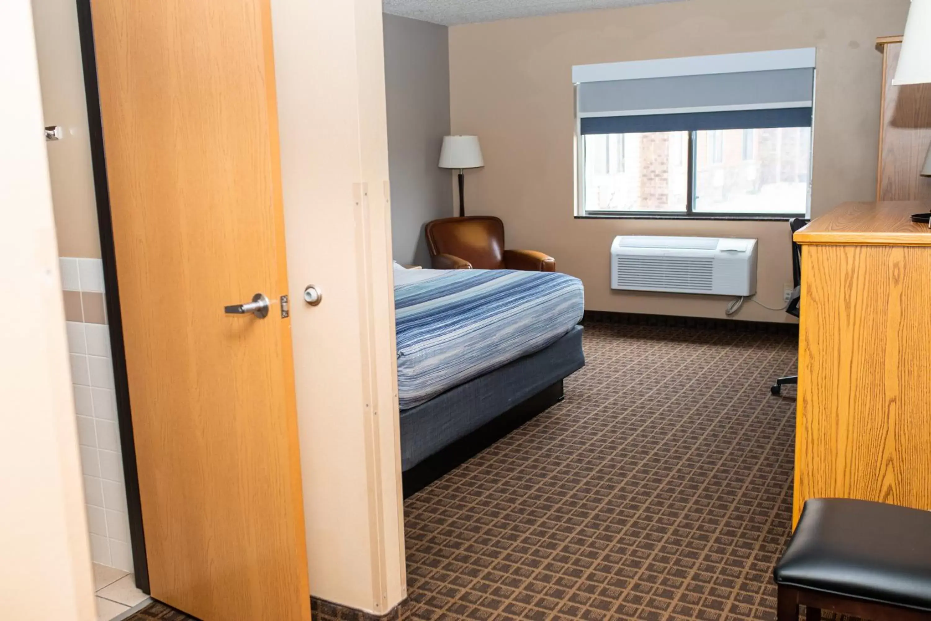 Bed in AmericInn by Wyndham Aberdeen Event Center