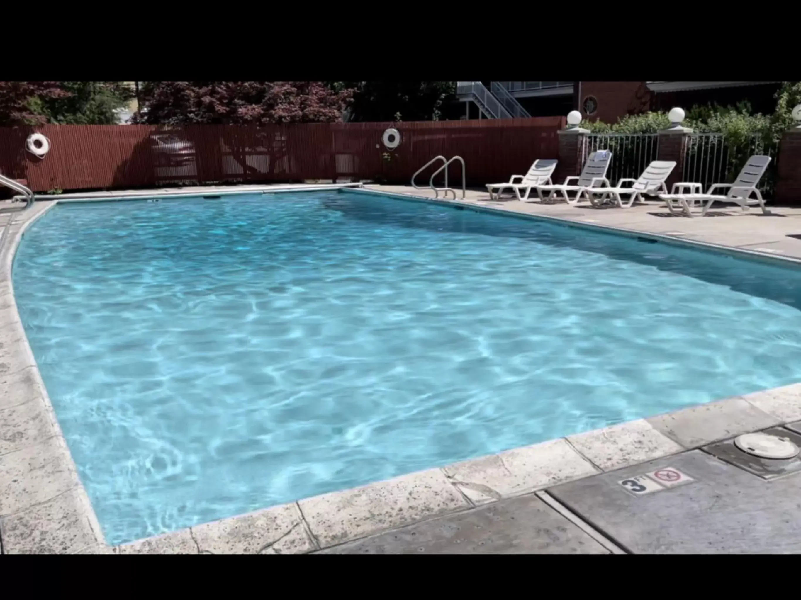 Swimming Pool in Baugh Motel, SureStay Collection by Best Western