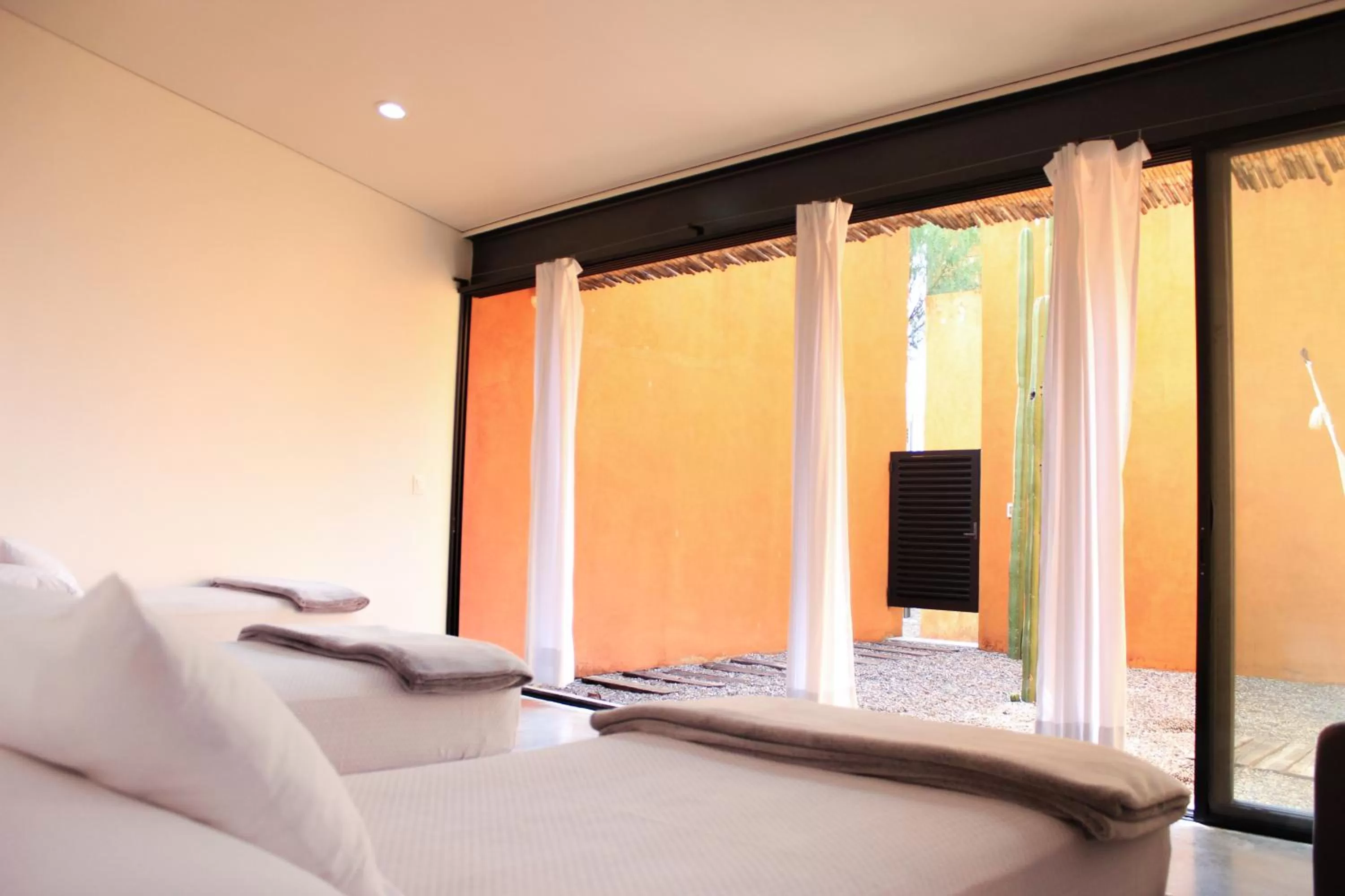 Bed in Hotel Cosijo - San Jeronimo Tlacochahuaya