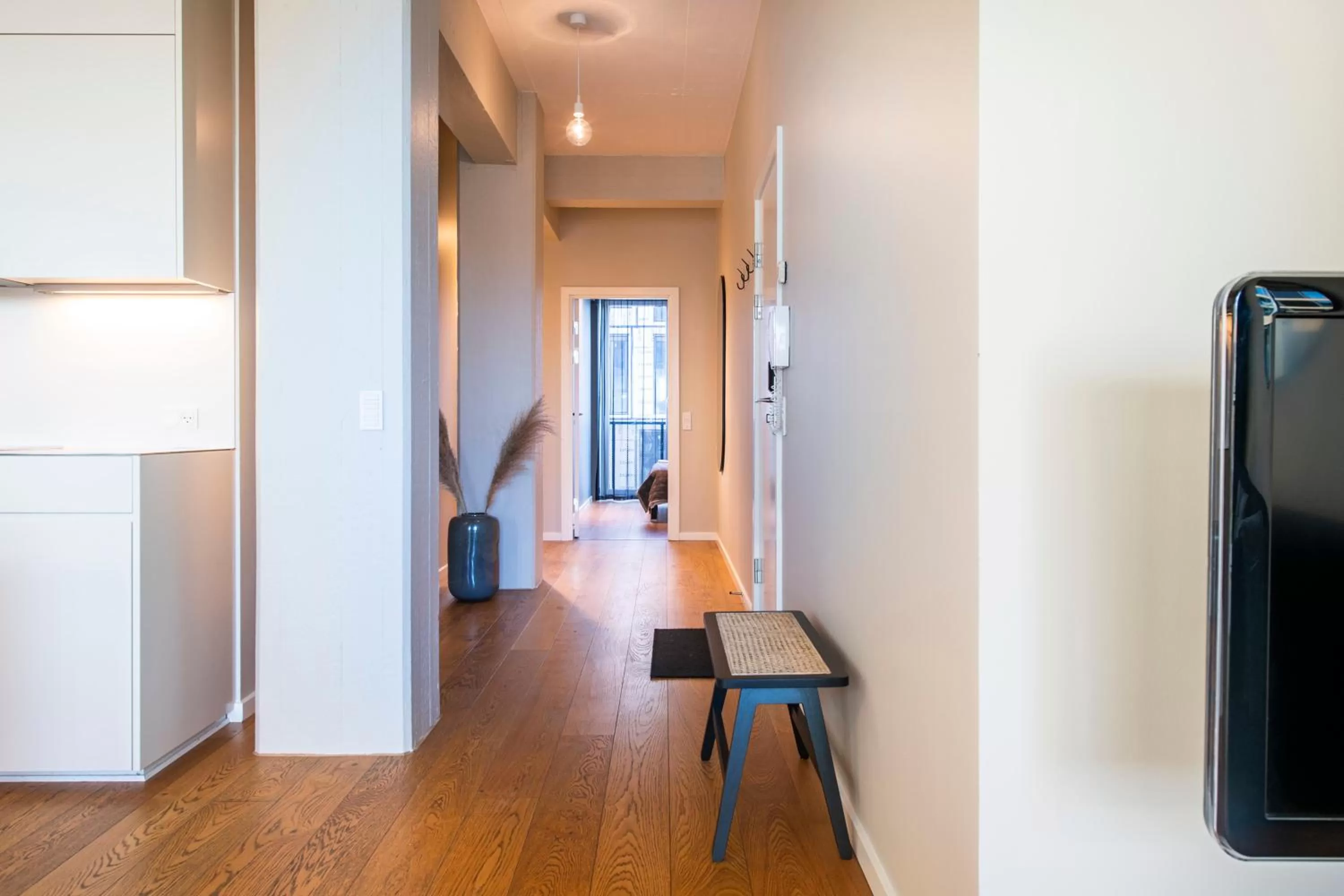 Living room, TV/Entertainment Center in By The Pier apartments - Into This Place