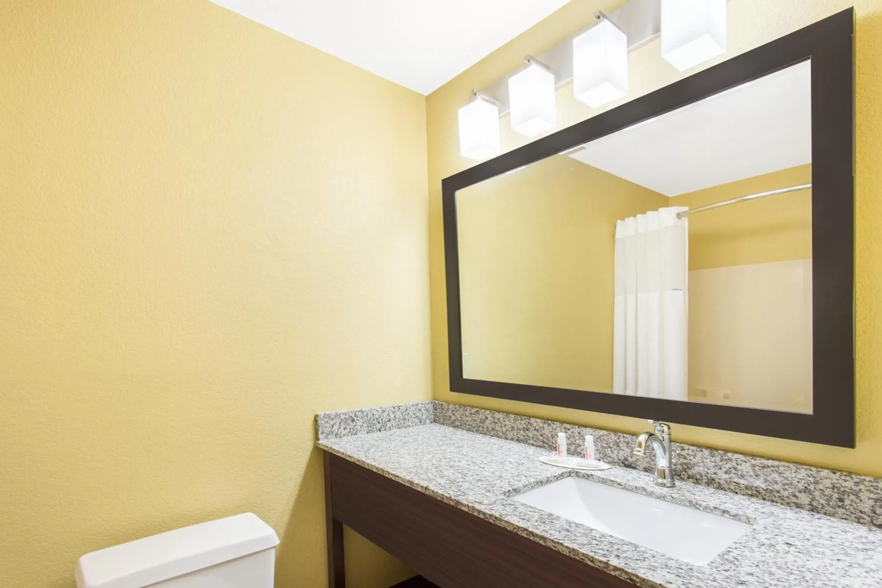 Bathroom in Days Inn & Suites by Wyndham Davenport East