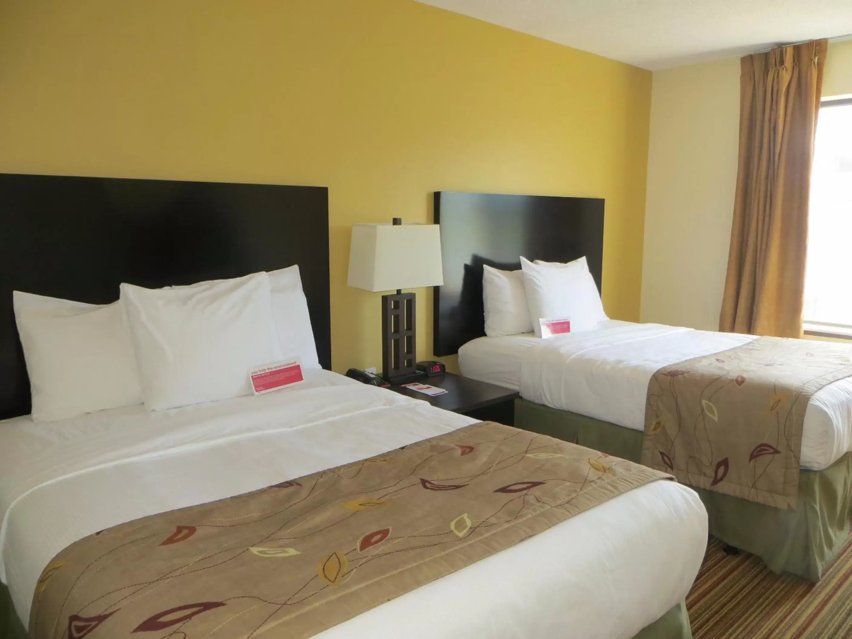 Bed in Ramada by Wyndham Wisconsin Dells