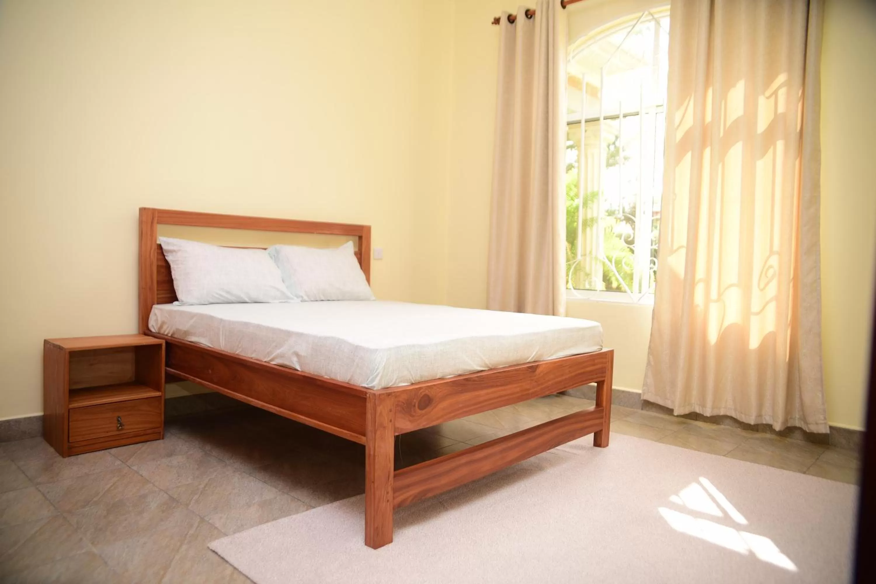 Bed in Charming Eco-Homestay near Kilimanjaro International Airport