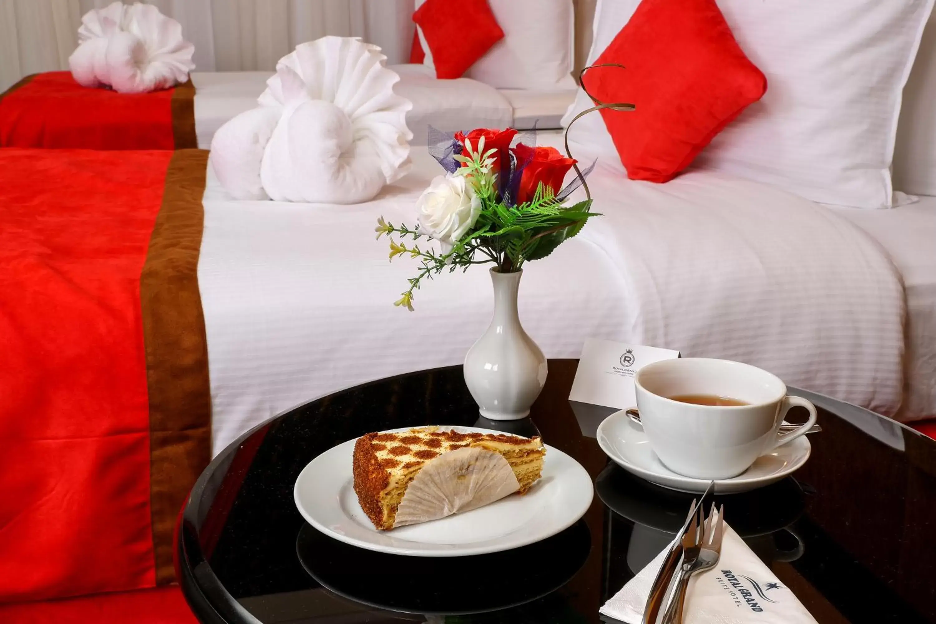 Bed, Coffee/Tea Facilities in Royal Grand Suite Hotel