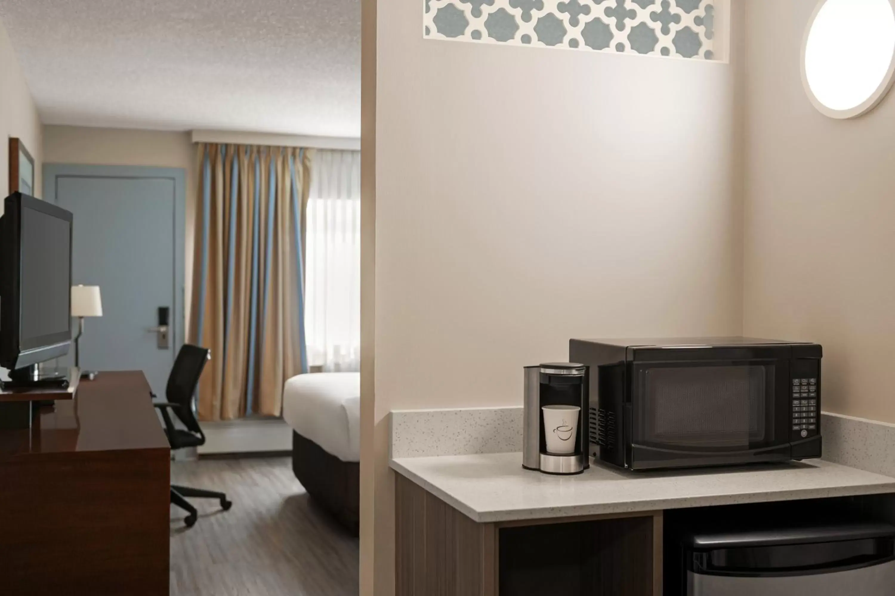 TV/Entertainment Center in Travelodge by Wyndham Calgary South