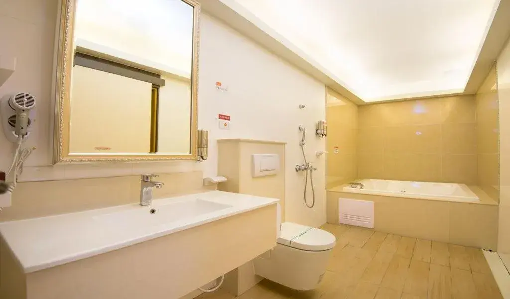 Photo of the whole room, Bathroom in M Garden Business Hotel