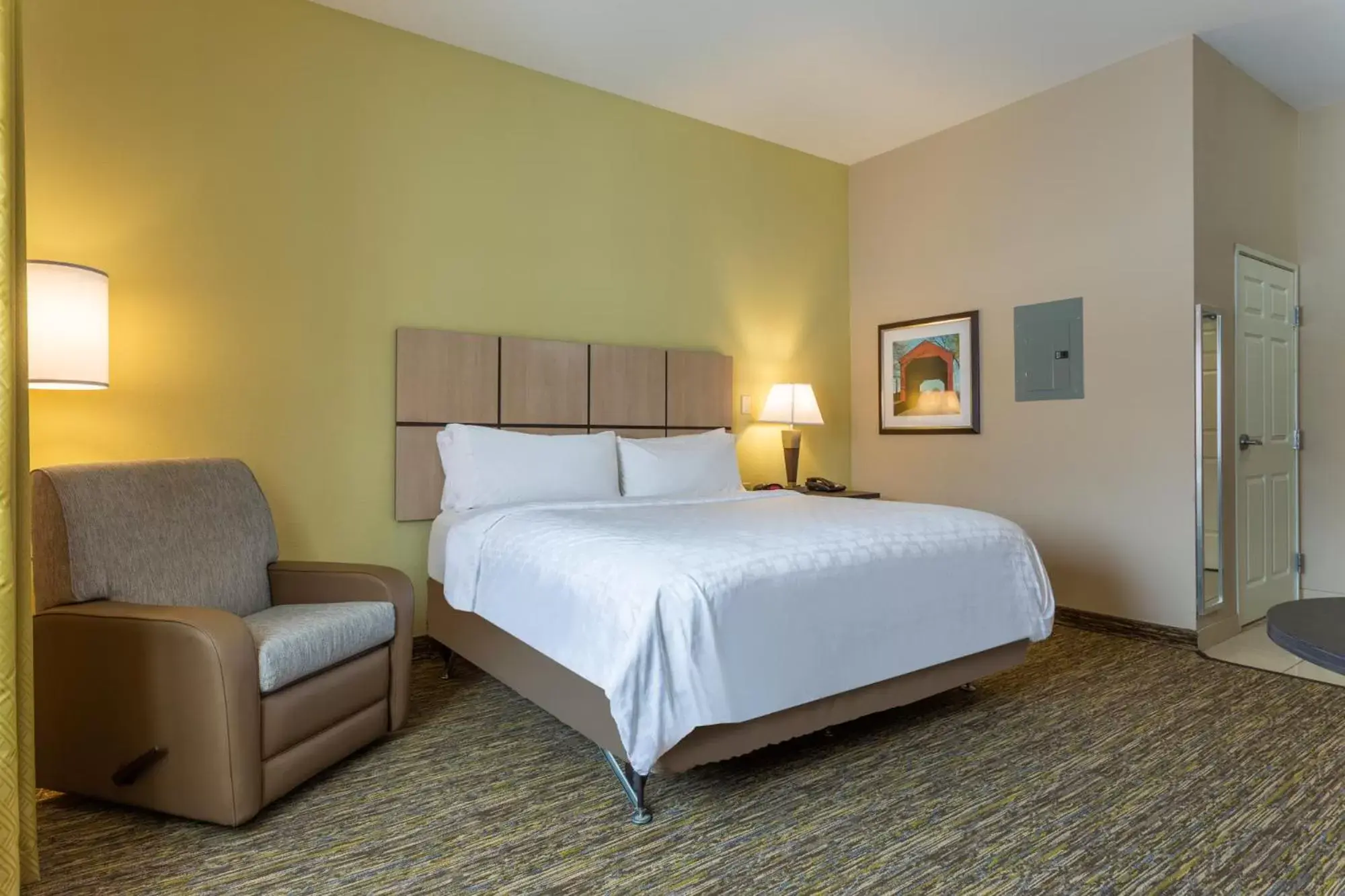 Bed in Candlewood Suites South Bend Airport, an IHG Hotel
