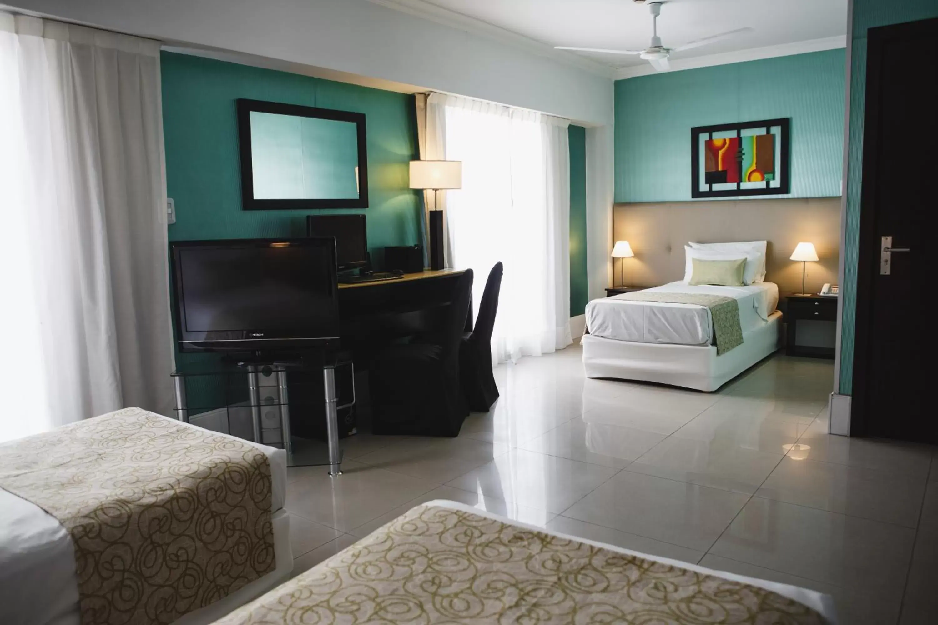 Bedroom, TV/Entertainment Center in Ker Urquiza Hotel