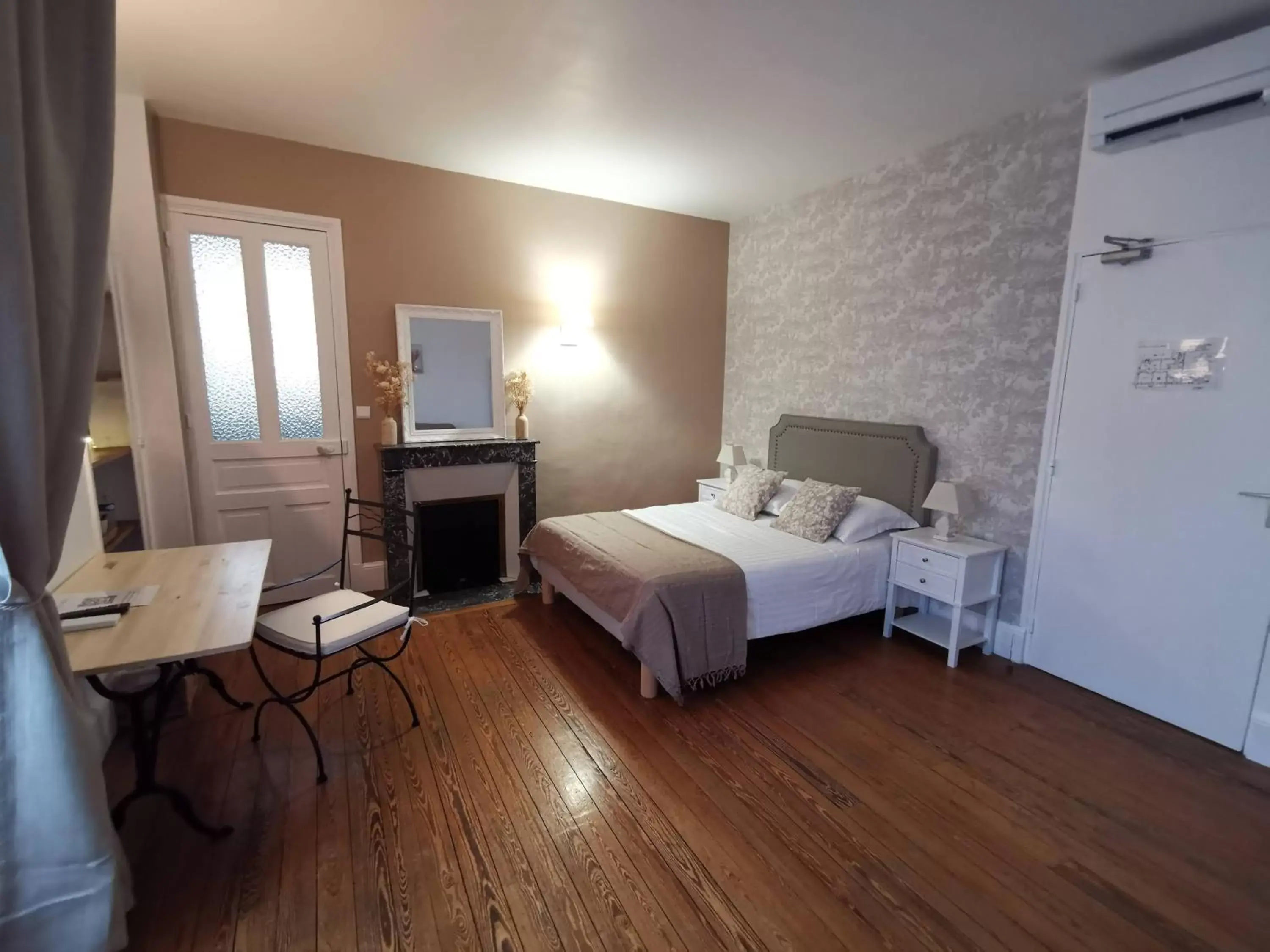 Photo of the whole room, Bed in Logis Hotel La Tourelle du Beffroi