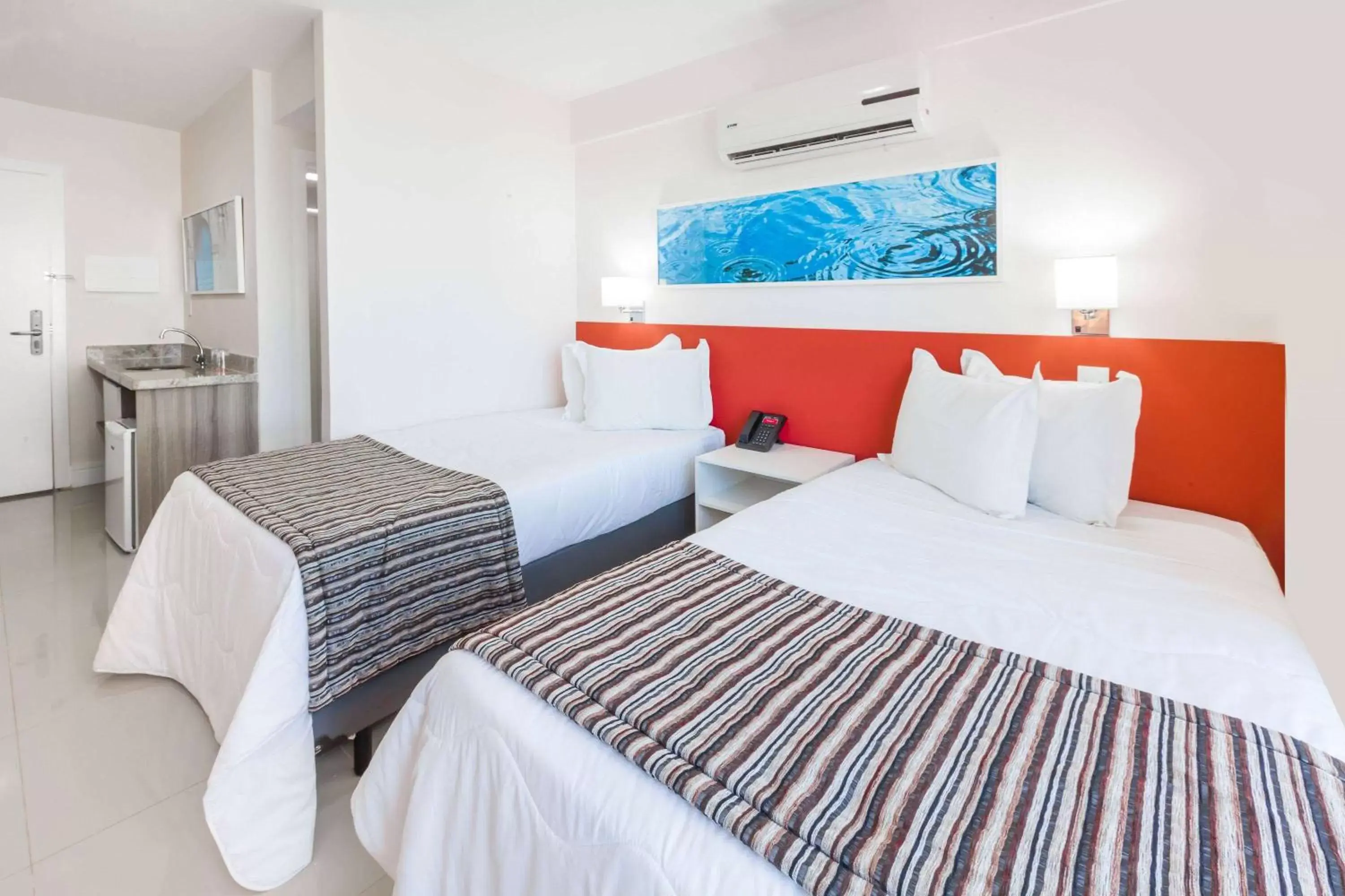 Photo of the whole room, Bed in Ramada Hotel & Suites Campos Pelinca