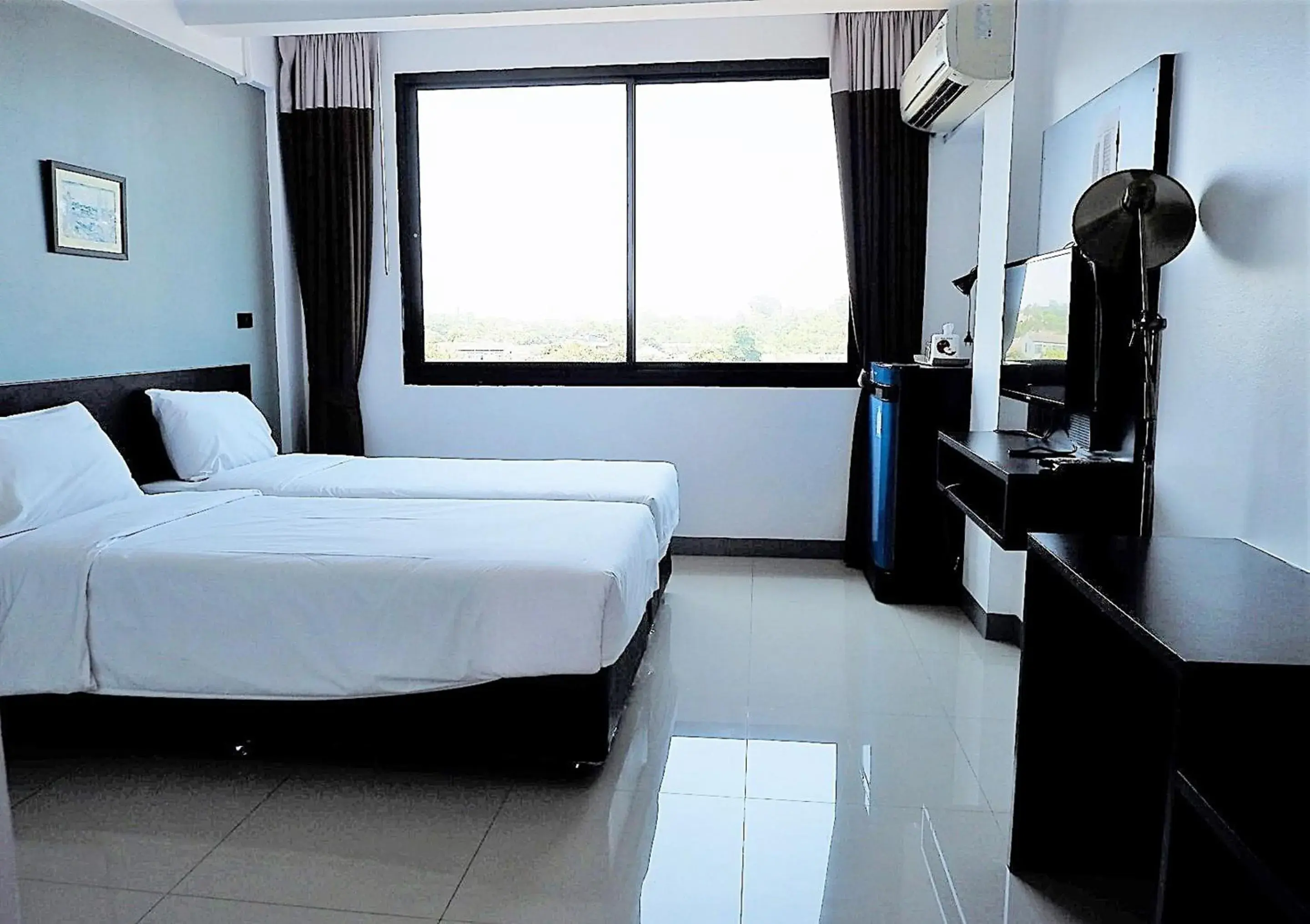 Bed in Izen Budget Hotel & Residence