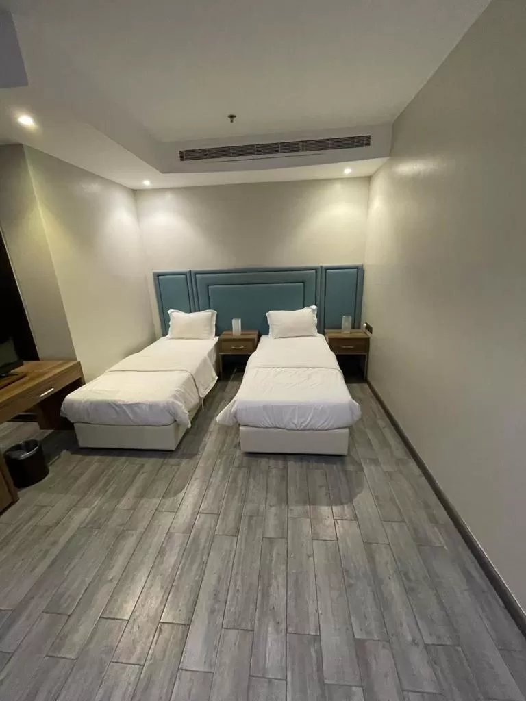 Bed in Stay Inn Suites