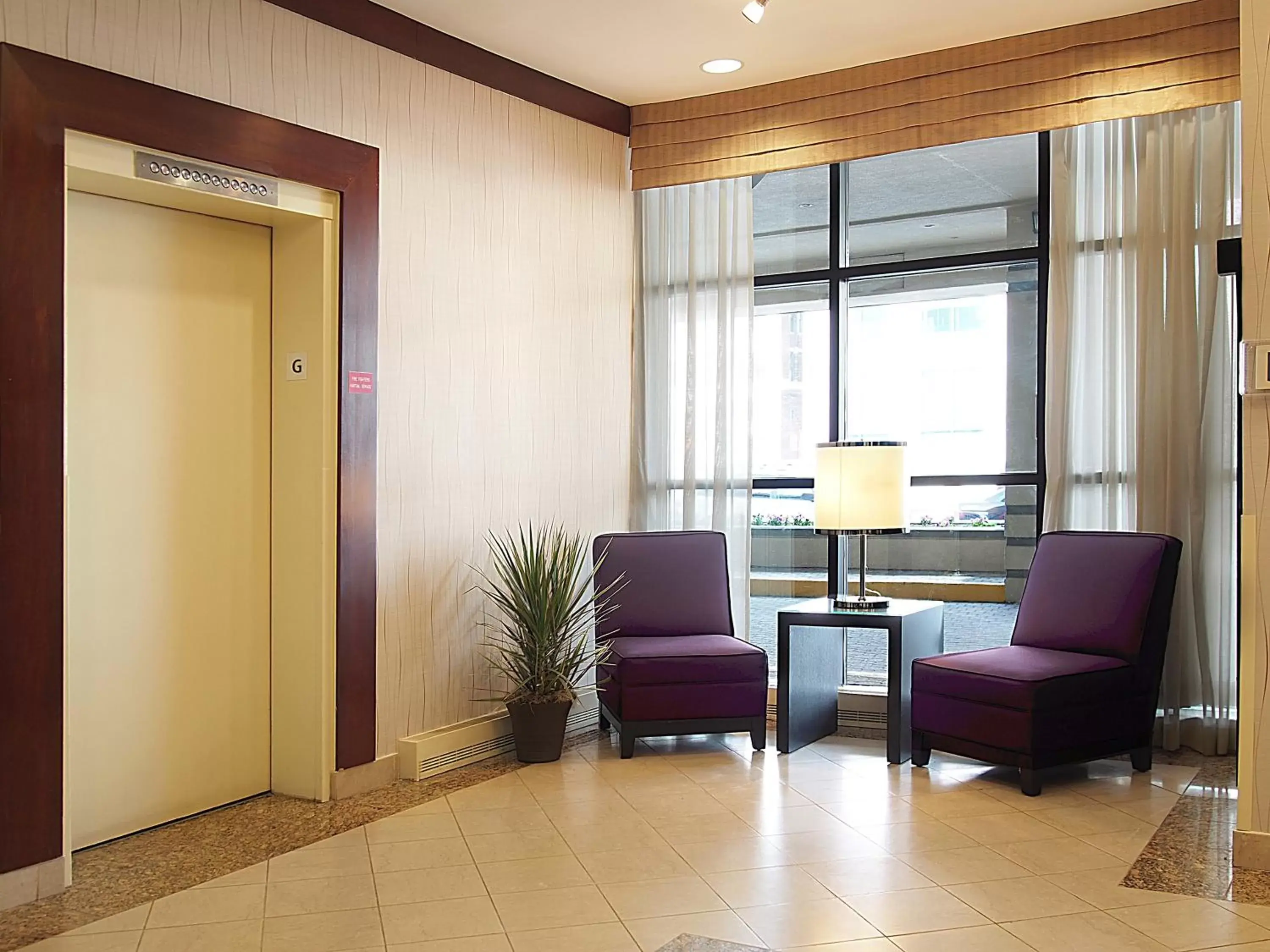 Property building, Seating Area in Holiday Inn & Suites Winnipeg Downtown, an IHG Hotel