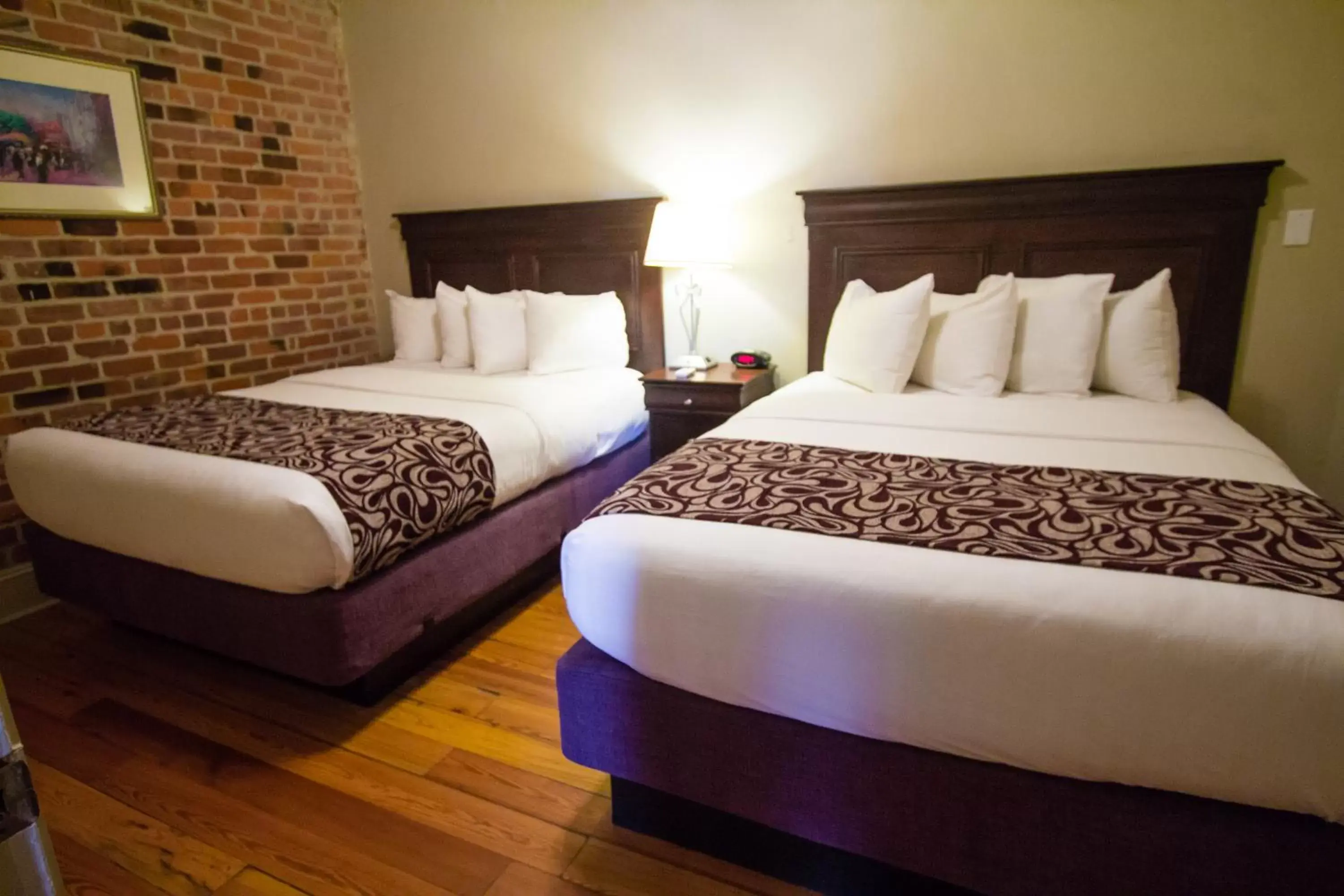 Bed in Inn on St. Peter, a French Quarter Guest Houses Property