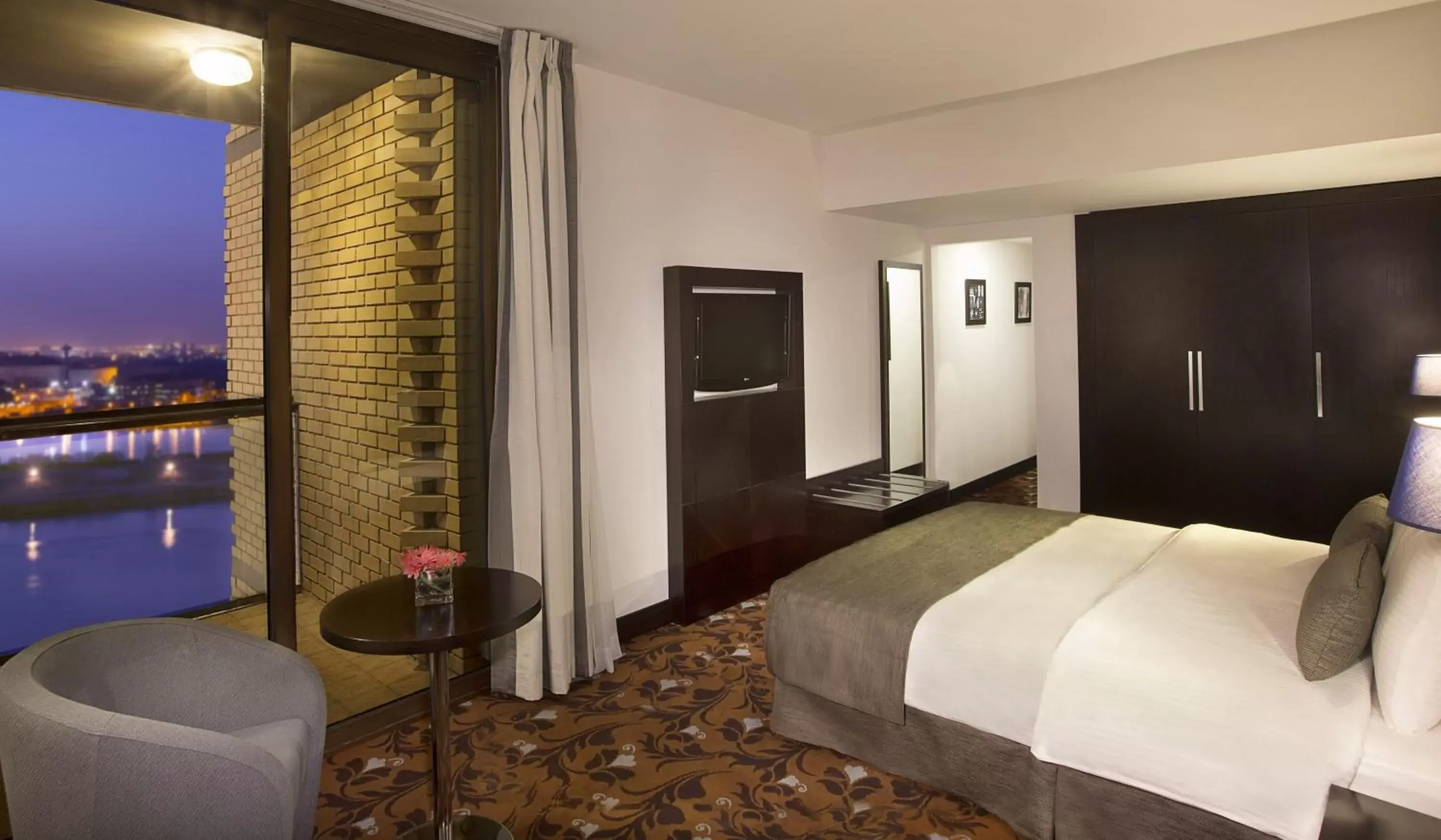 Bed in Babylon Rotana Hotel