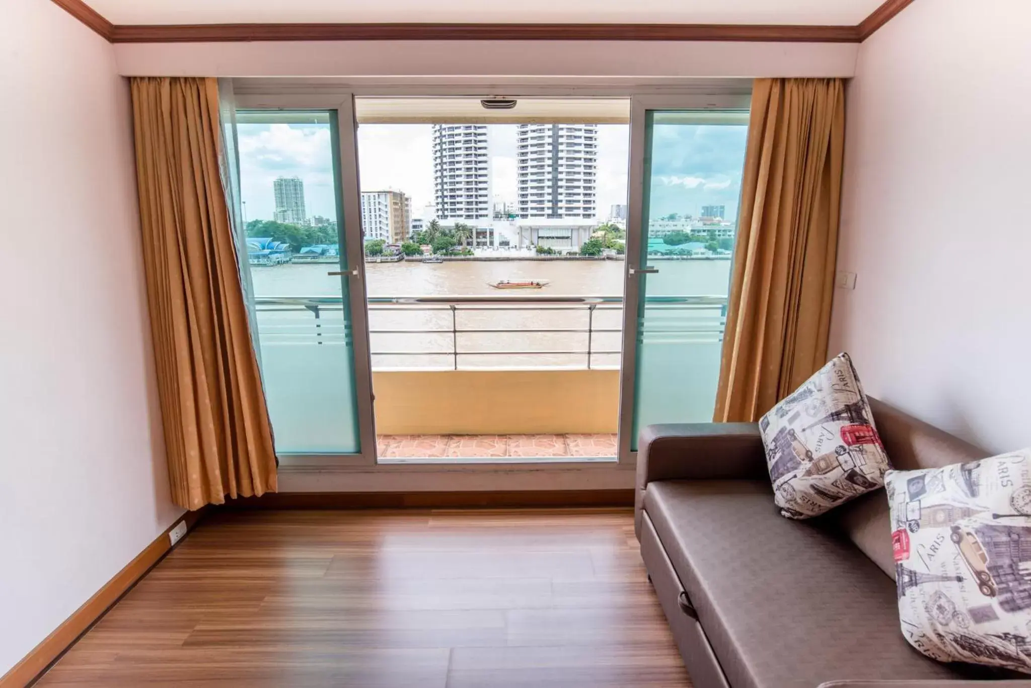 Living room in New Siam Riverside - SHA Certified