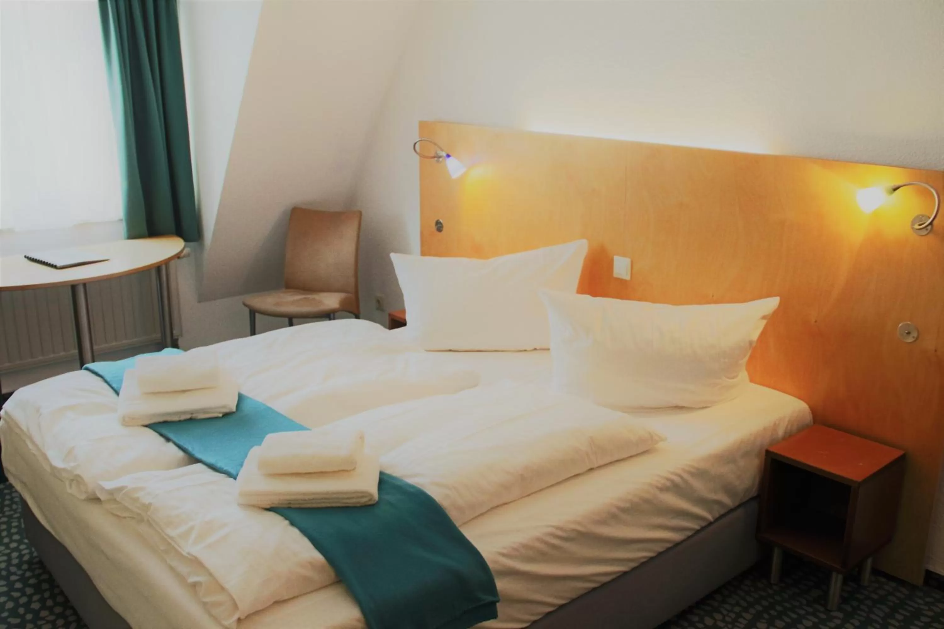 Bed in Check Inn Hotel Merseburg