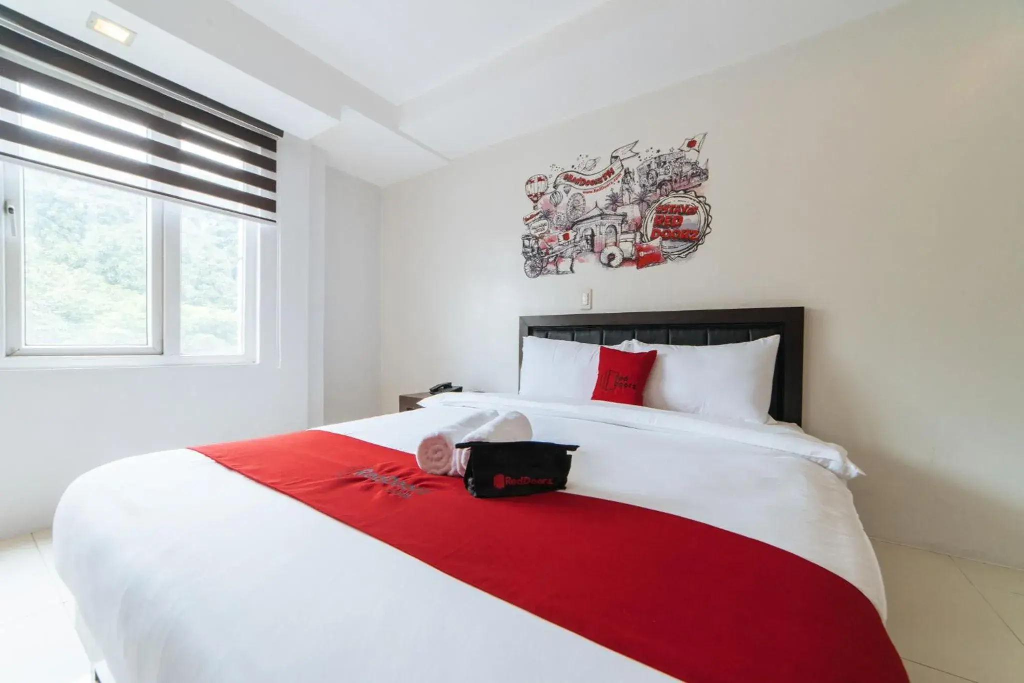 Photo of the whole room, Bed in RedDoorz Plus at One Liberty Hotel Kalayaan Avenue