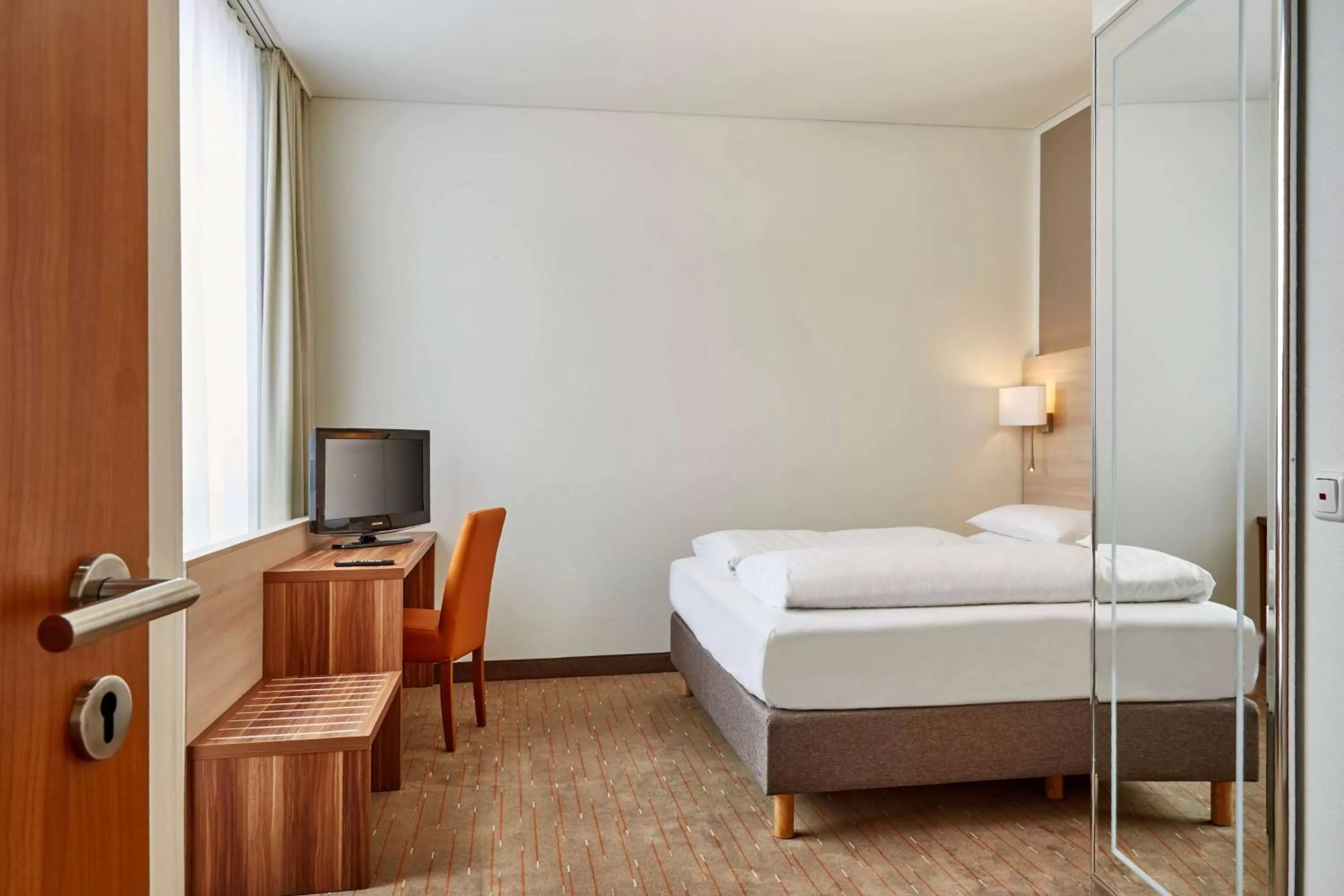 Photo of the whole room, Bed in H+ Hotel Berlin Mitte