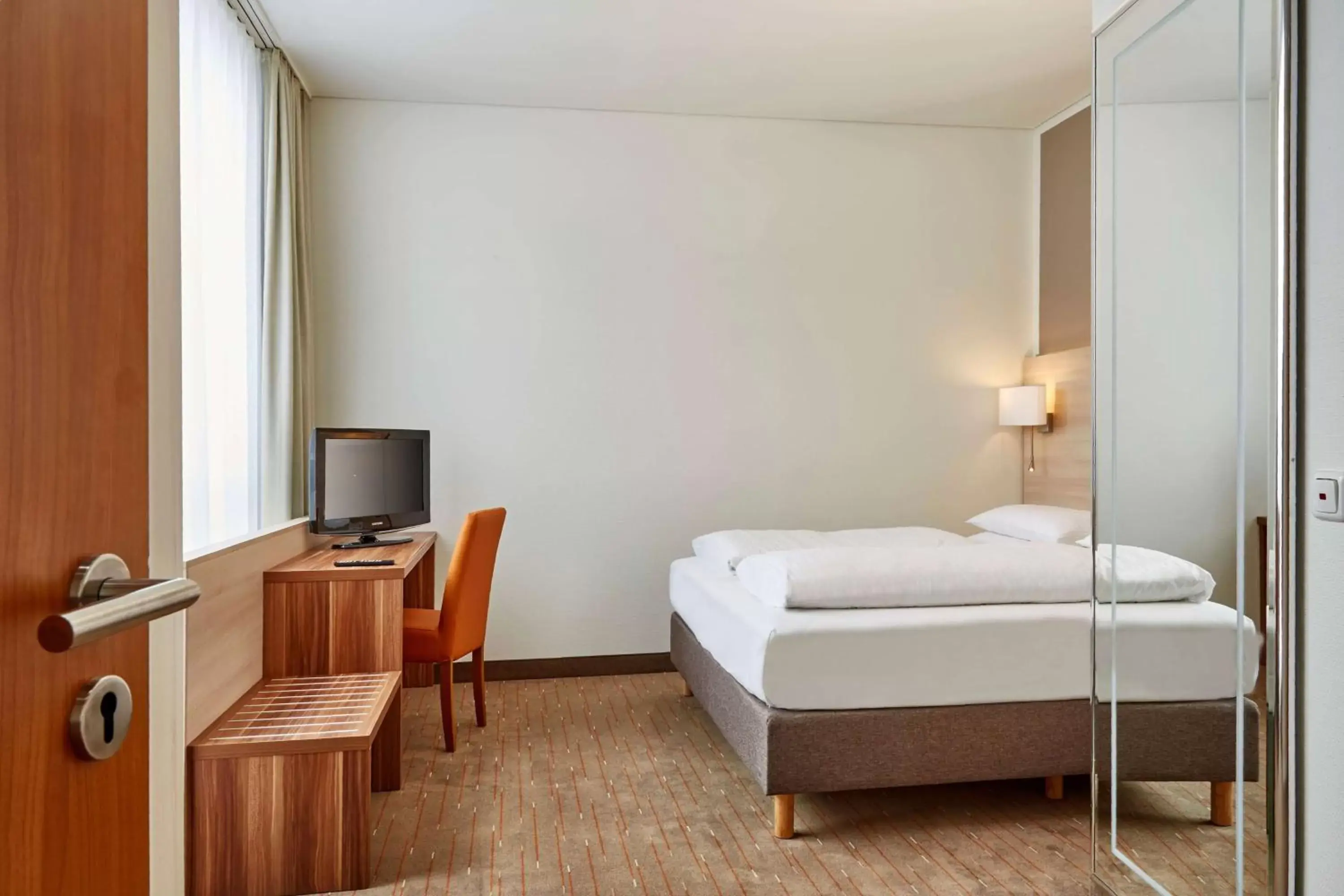 Photo of the whole room, Bed in H+ Hotel Berlin Mitte