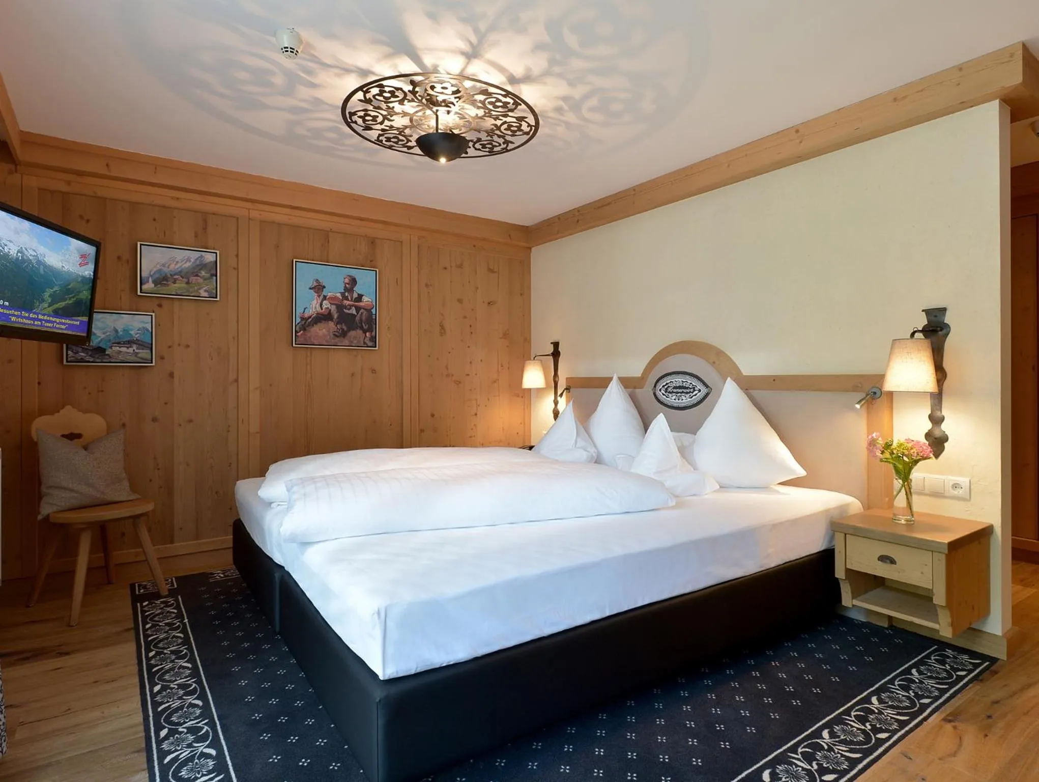 Bed in Alpenhotel Kramerwirt