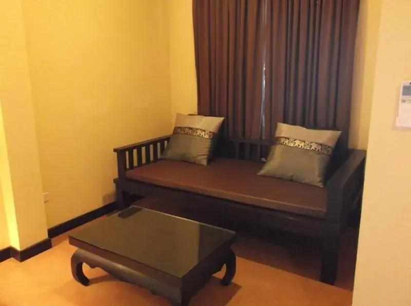 Bed, Seating Area in Chalicha Resort