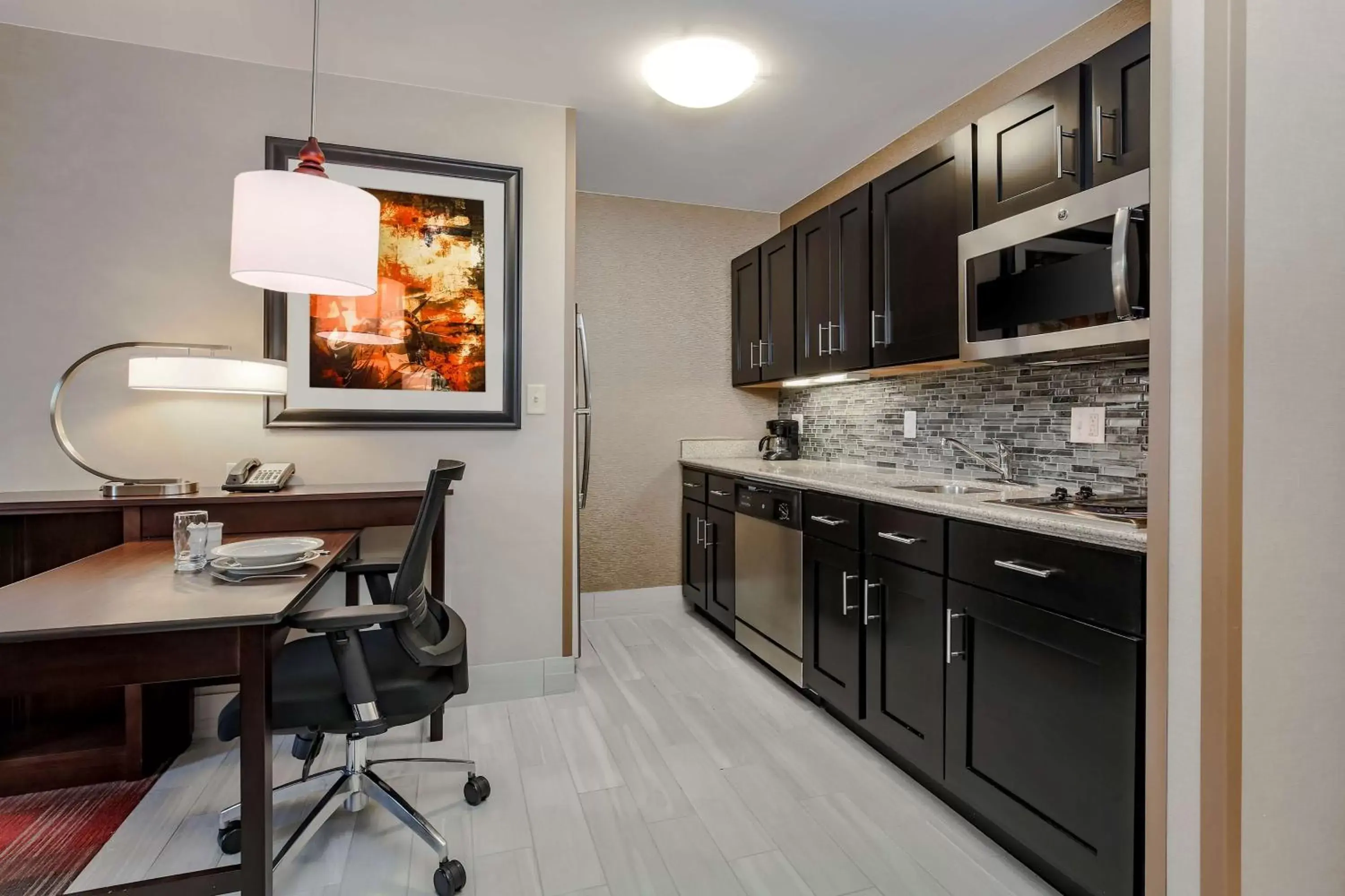 Bedroom, Kitchen/Kitchenette in Homewood Suites by Hilton Long Island-Melville