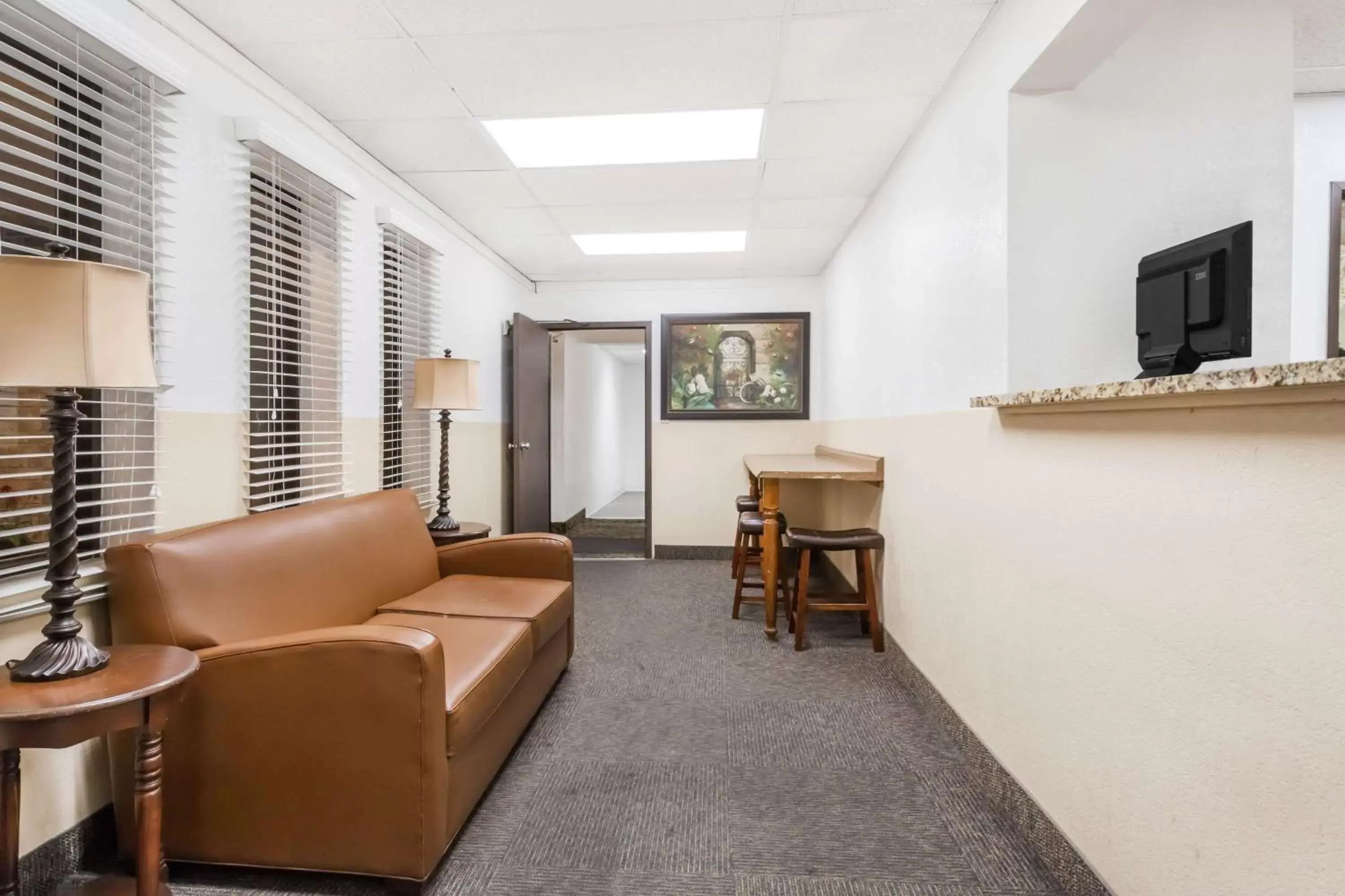 Lobby or reception in Super 8 by Wyndham Montgomery Maybrook Lobby or reception in Super 8 by Wyndham Montgomery Maybrook
