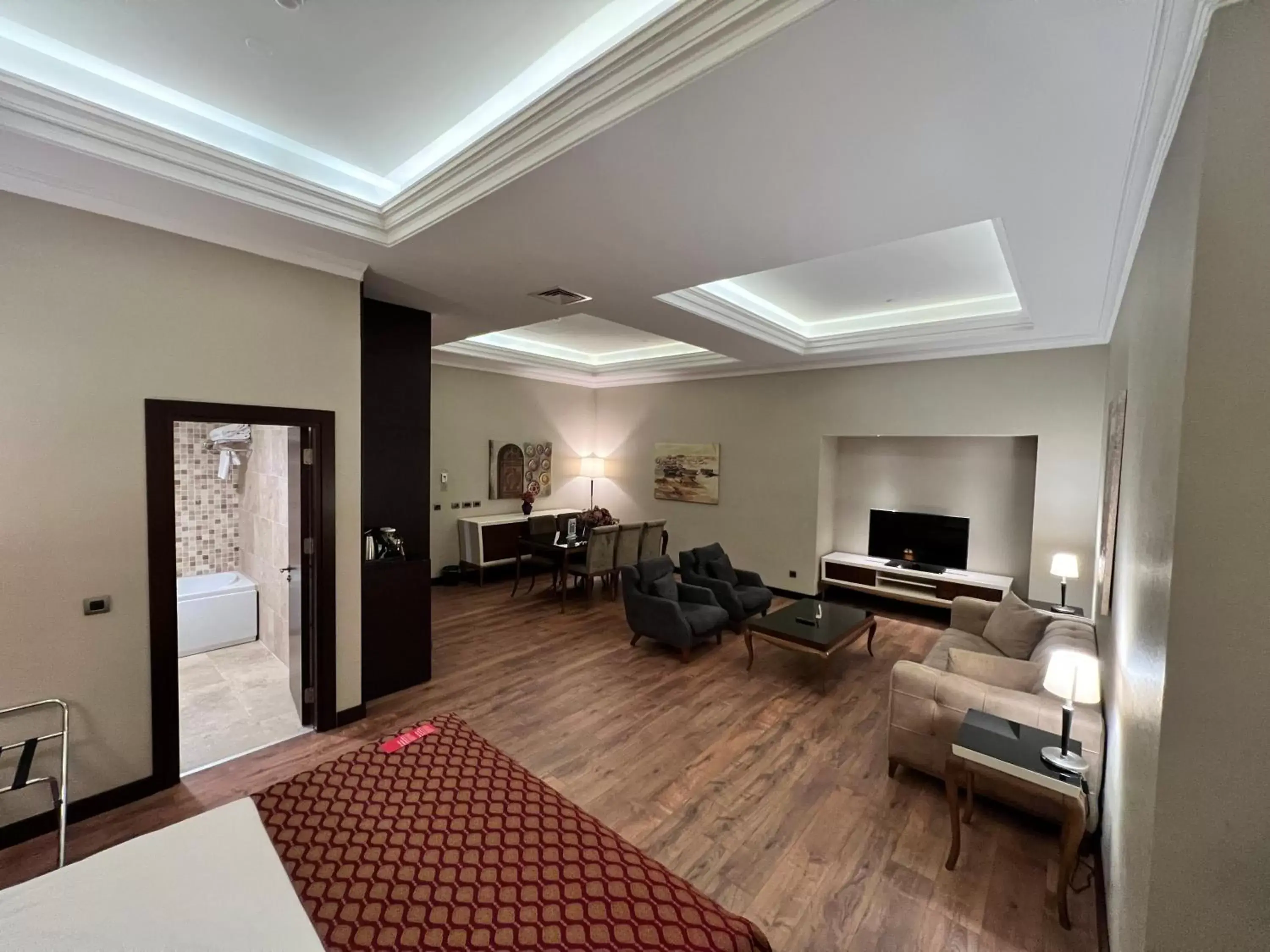 Bed, Seating Area in Ramada Hotel & Suites by Wyndham Istanbul Merter