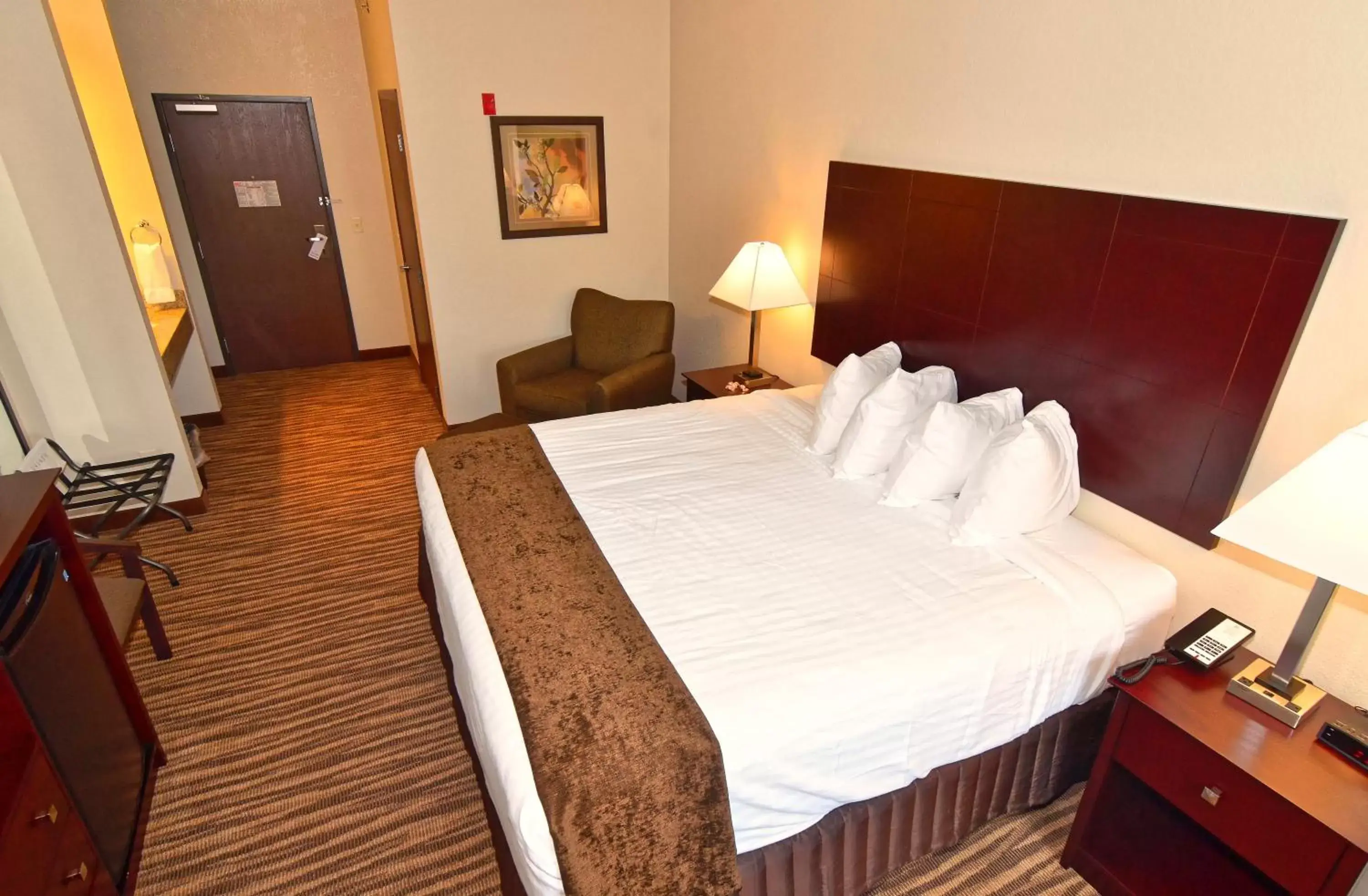 Bed in Cobblestone Inn & Suites - Clarion