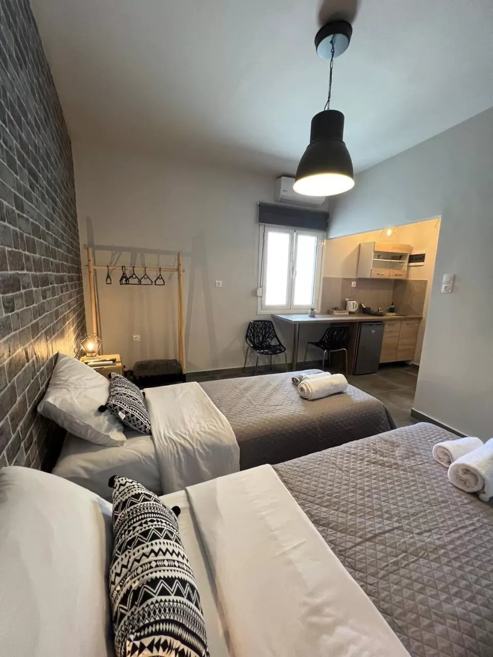 Bed in Elefsinian Mysteries Apartments