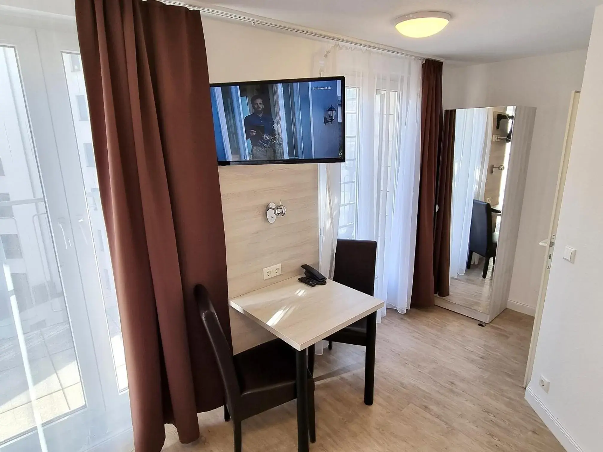 Bedroom, TV/Entertainment Center in Adler Hotel Frankfurt