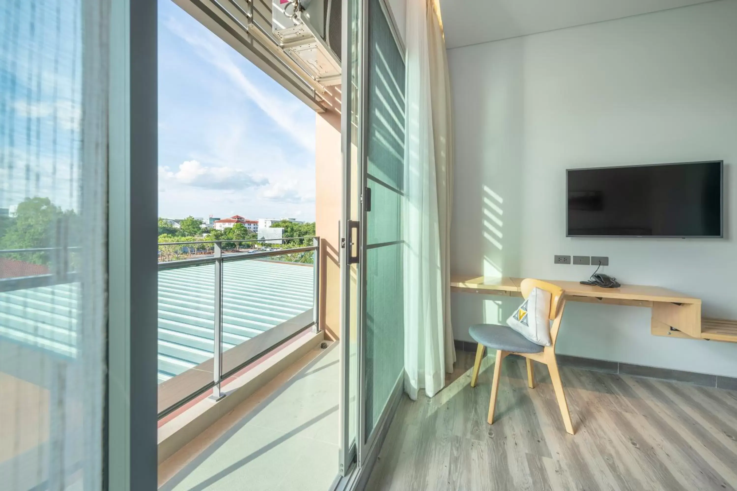 Bedroom, TV/Entertainment Center in Aisana Hotel Korat