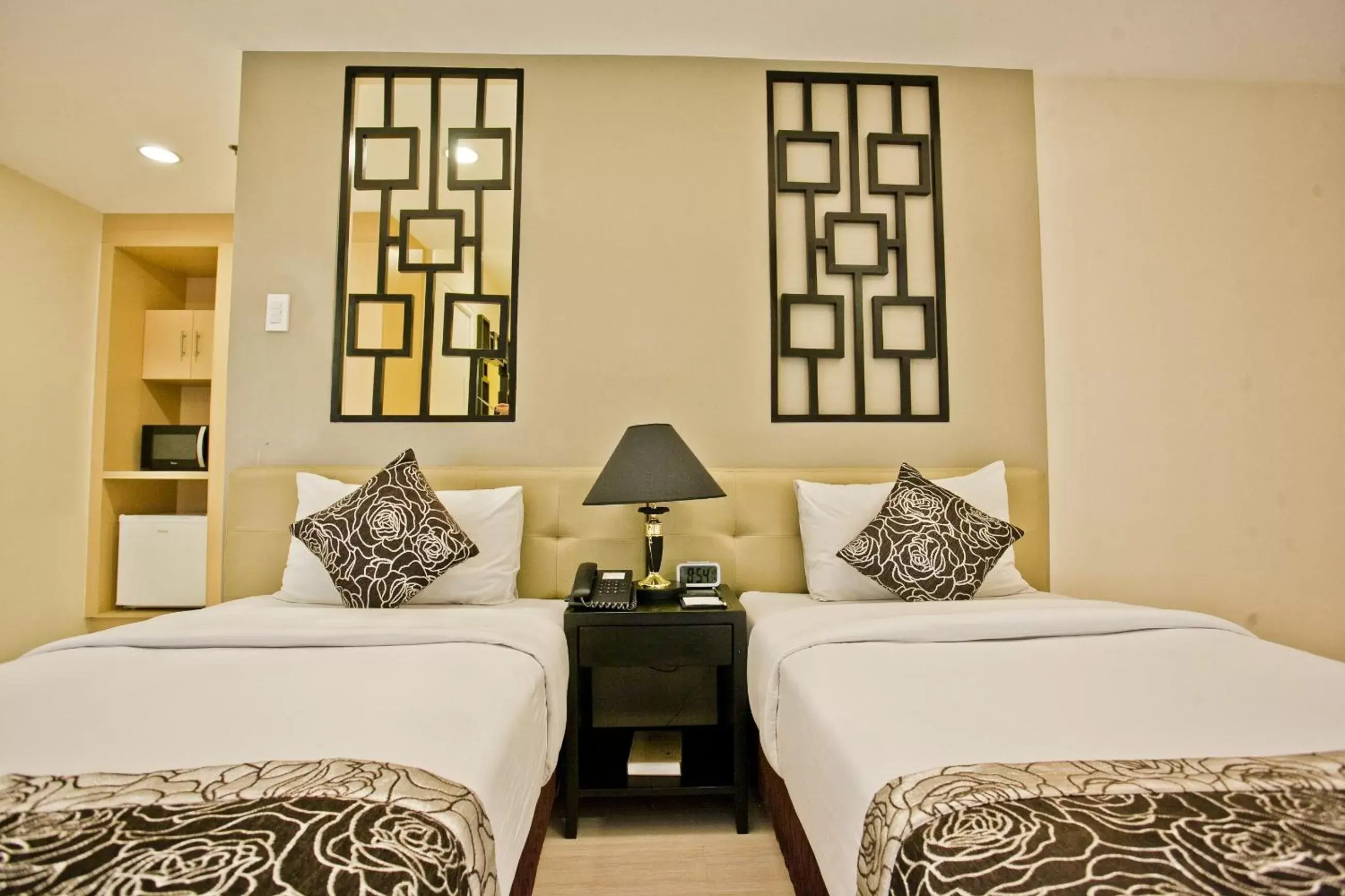 Bed in The Exchange Regency Residence Hotel Managed by HII