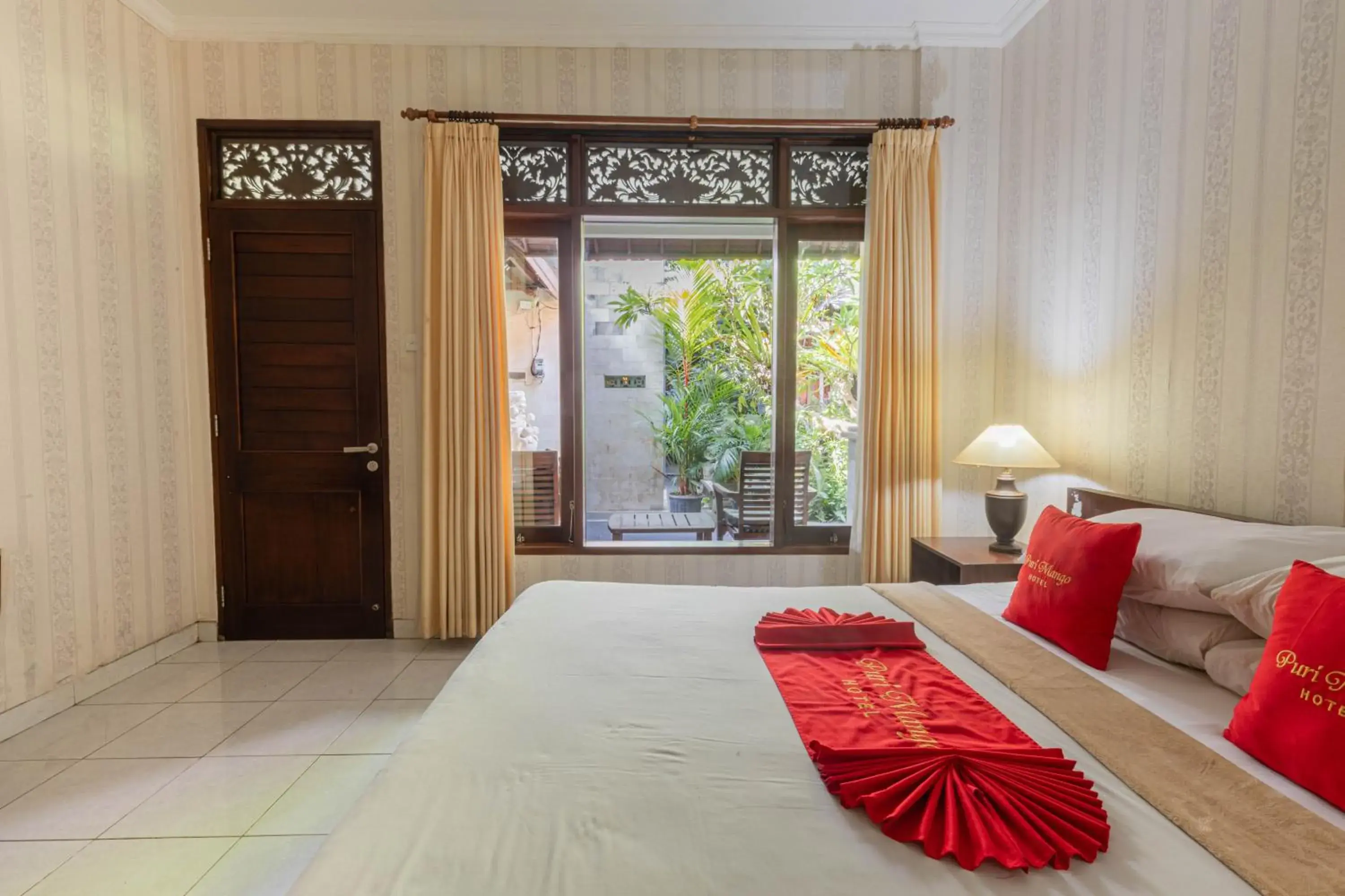 Bedroom, Bed in OYO 3868 Puri Mango Hotel