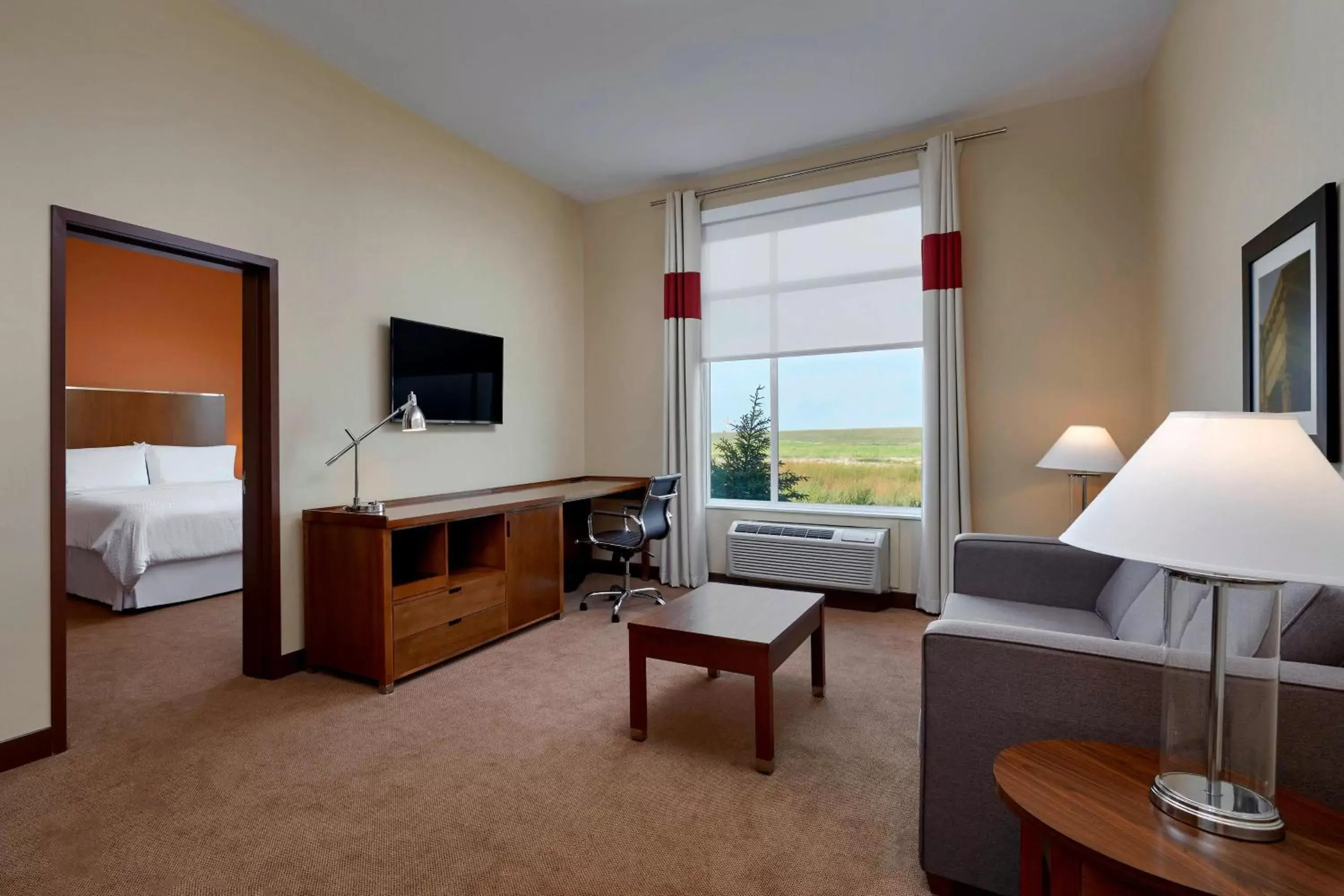 Photo of the whole room, TV/Entertainment Center in Four Points by Sheraton Grande Prairie