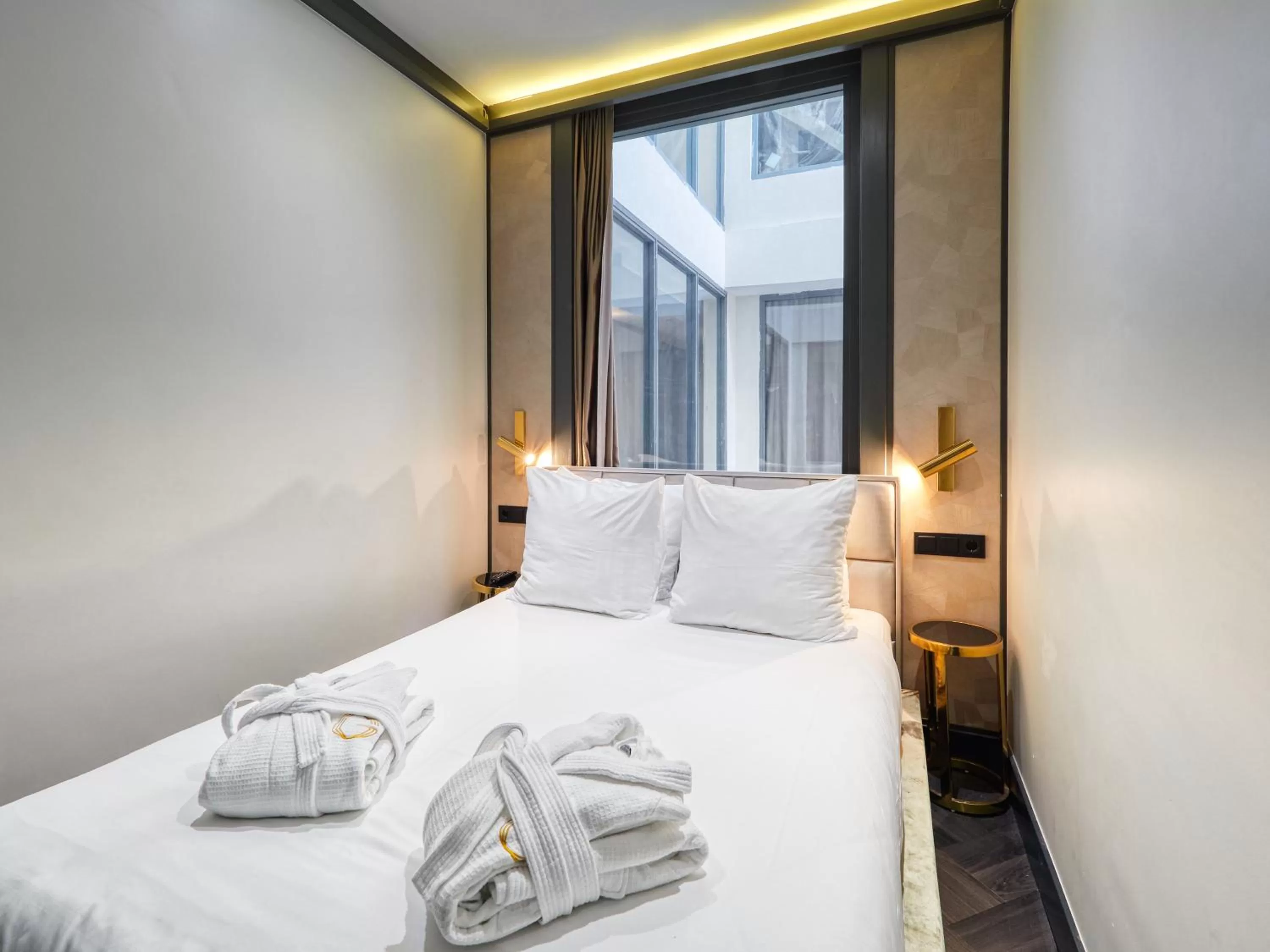 Bed in Triple G Hotels