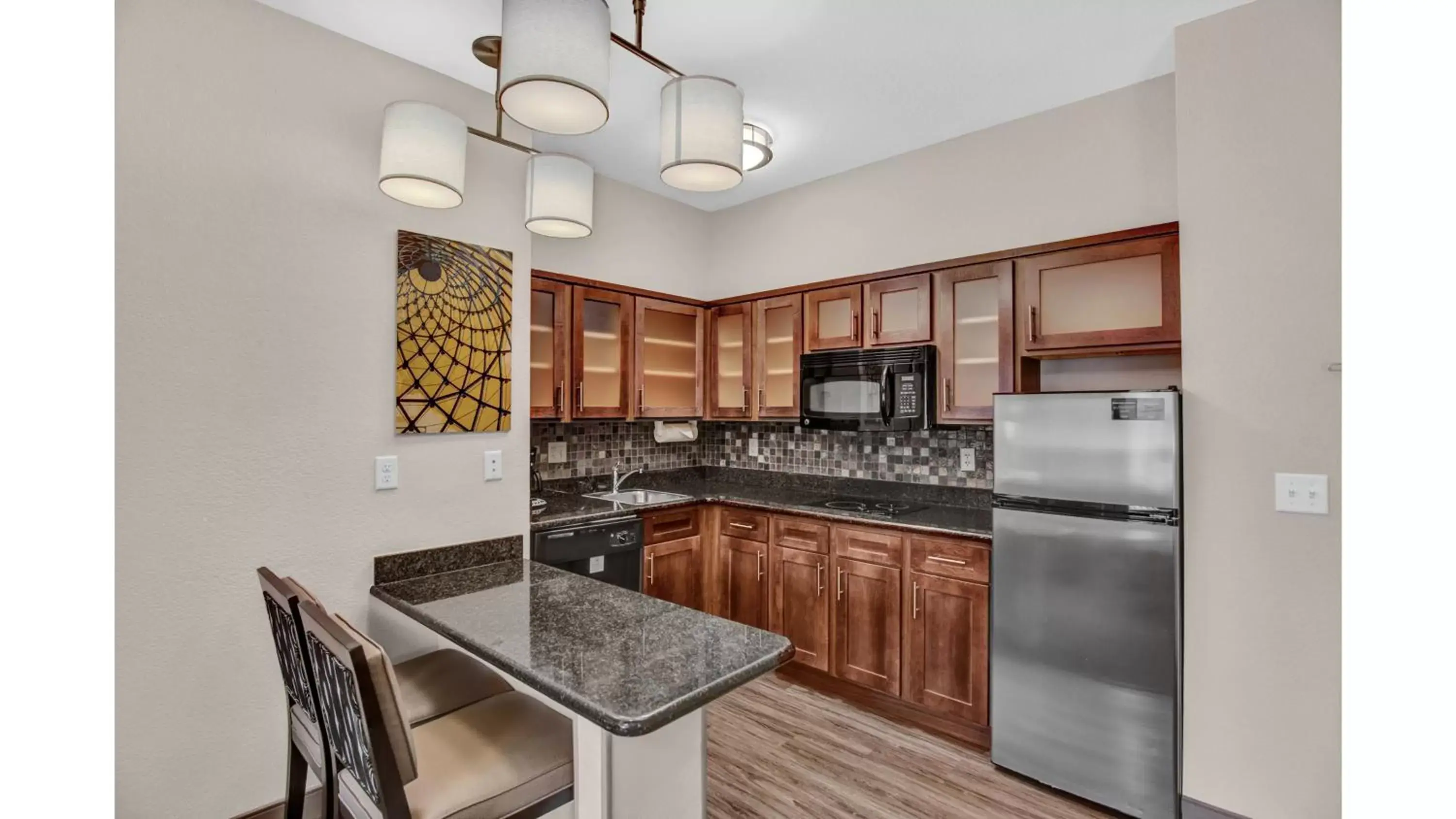 Photo of the whole room, Kitchen/Kitchenette in Staybridge Suites Salt Lake-West Valley City, an IHG Hotel