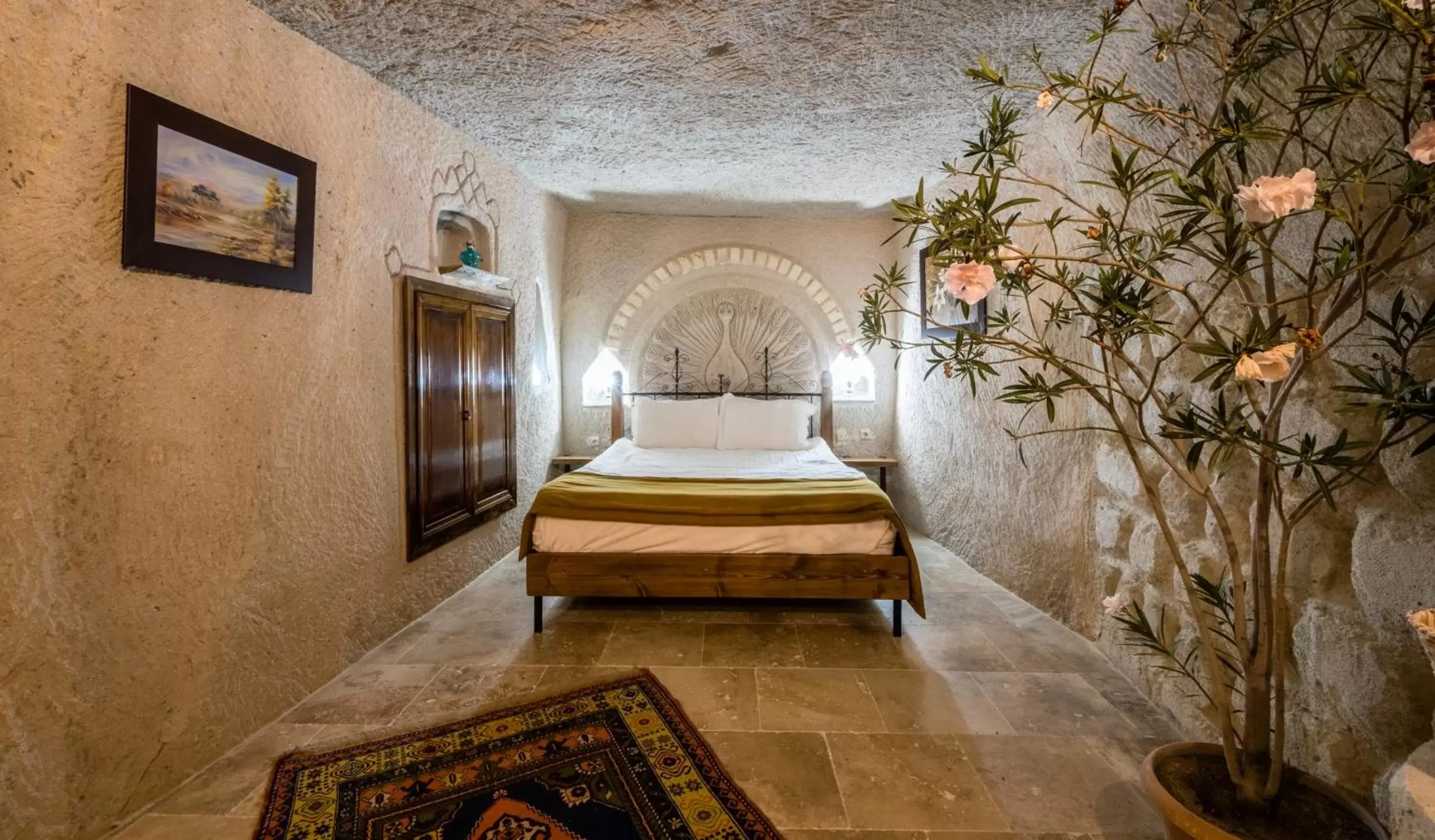 Bed in Elite Cave Suites