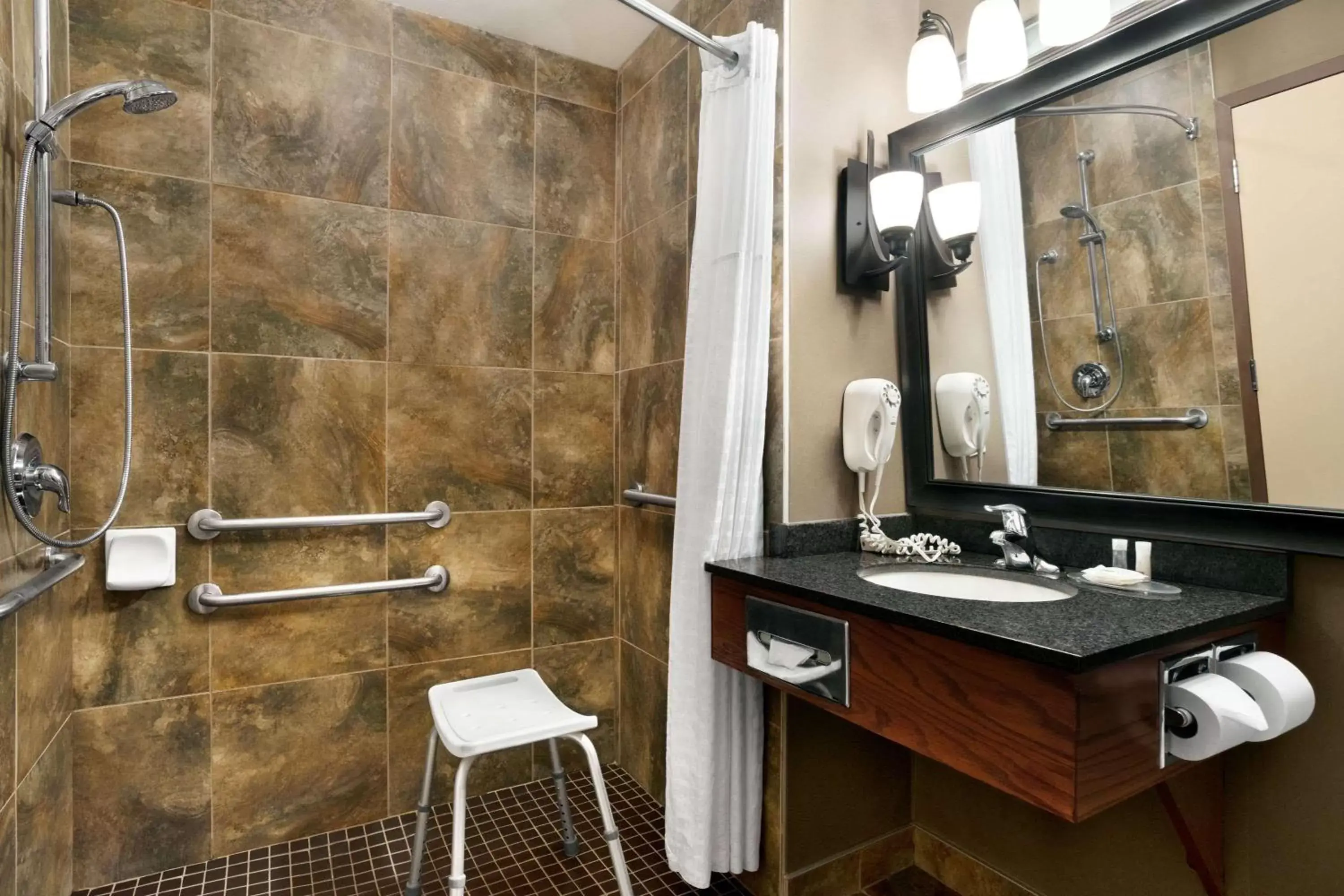 Bathroom in Days Inn & Suites by Wyndham Strathmore