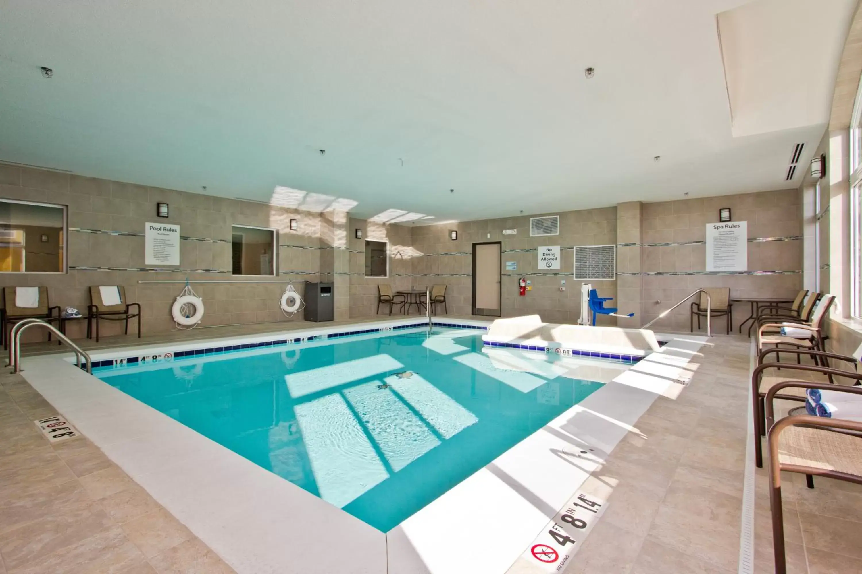 Swimming Pool in Holiday Inn Express and Suites Denver East Peoria Street, an IHG Hotel