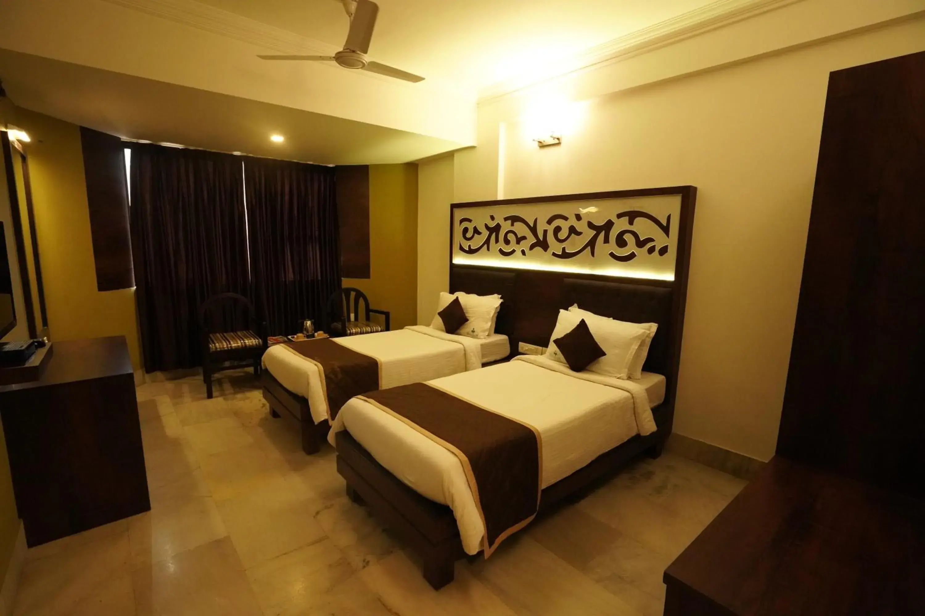 Photo of the whole room, Bed in Hotel Mangalore International