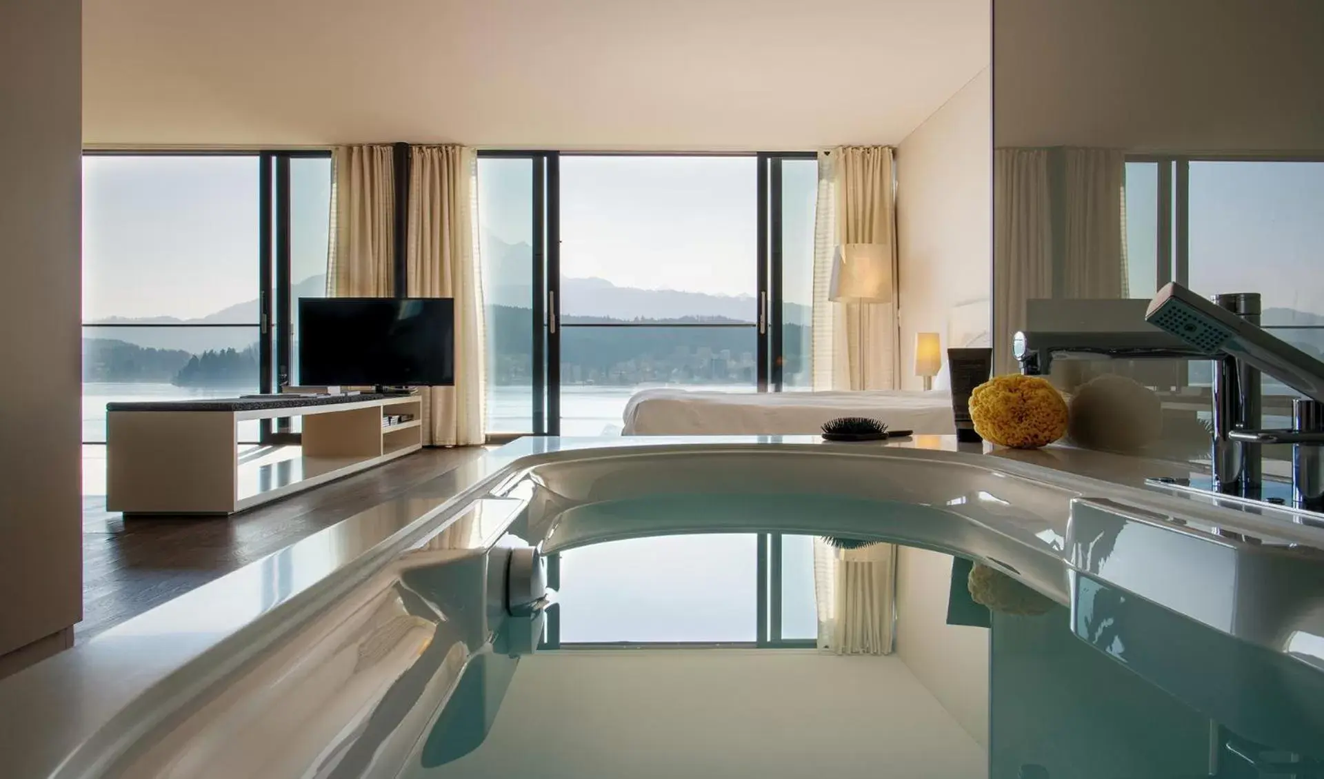 Photo of the whole room, Swimming Pool in HERMITAGE Lake Lucerne - Beach Club & Lifestyle Hotel